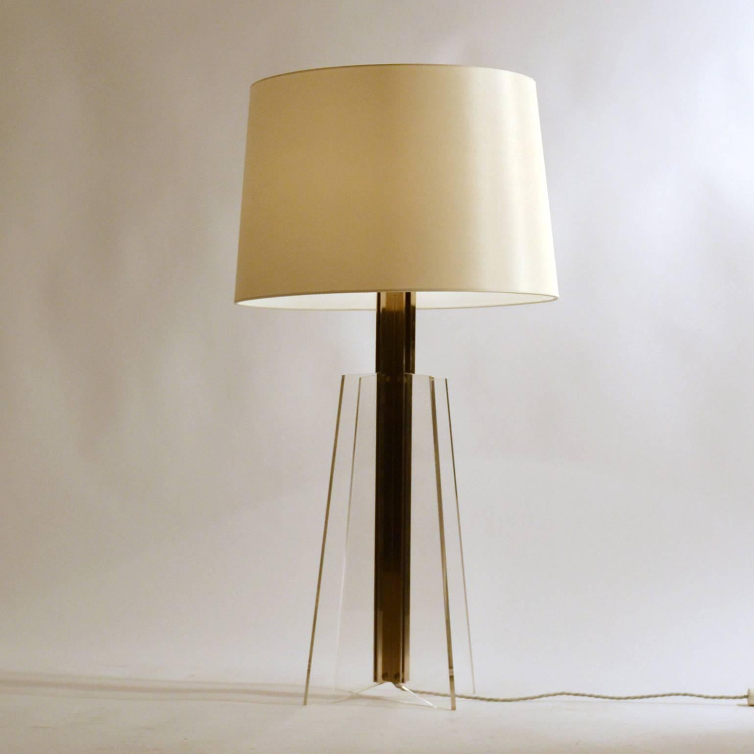 Large pair of Kaiser table lamps have a center pillar in chrome from which perspex sheets are connected in four directions. The cream silk shades are new.