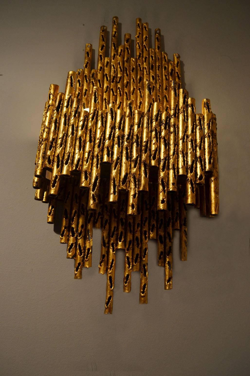 Expressive Brutalist wall lamps designed by Marcello Fantoni in gilded metal.
They have been gilded possibly at a later date.