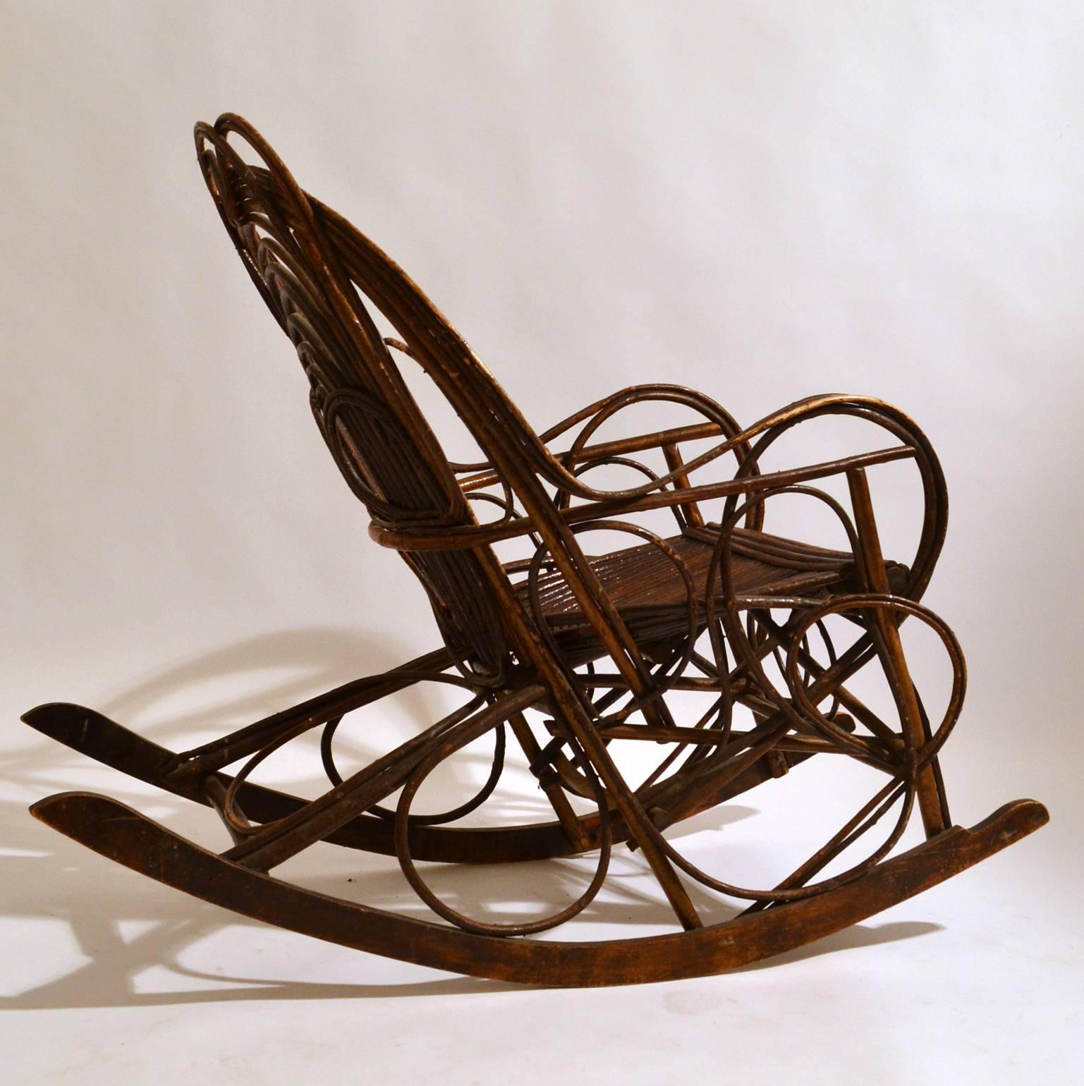 Relaxing Scandinavian early 20th century hand made rocking chair constructed in bentwood willow. Curvaceous lines create strength and make a beautiful pattern. The rocking slats are made of bent wood. The chair is extremely comfortable.