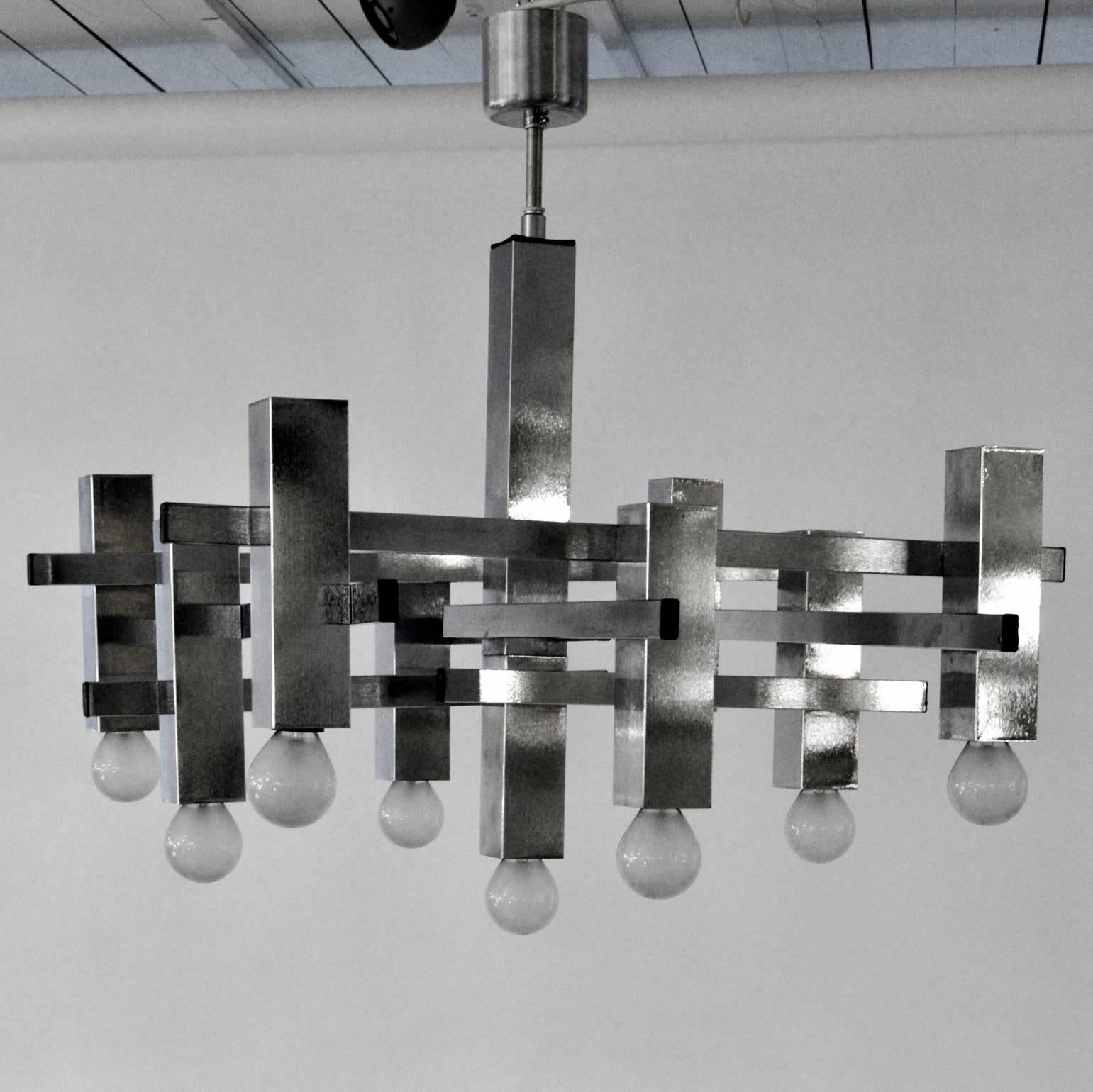 Geometric pair of brushed chrome chandeliers with nine lights, style of Sciolari, Belgian, 1970s.

The height can be adjusted on request.
The lights are rewired and ready for immediate use.