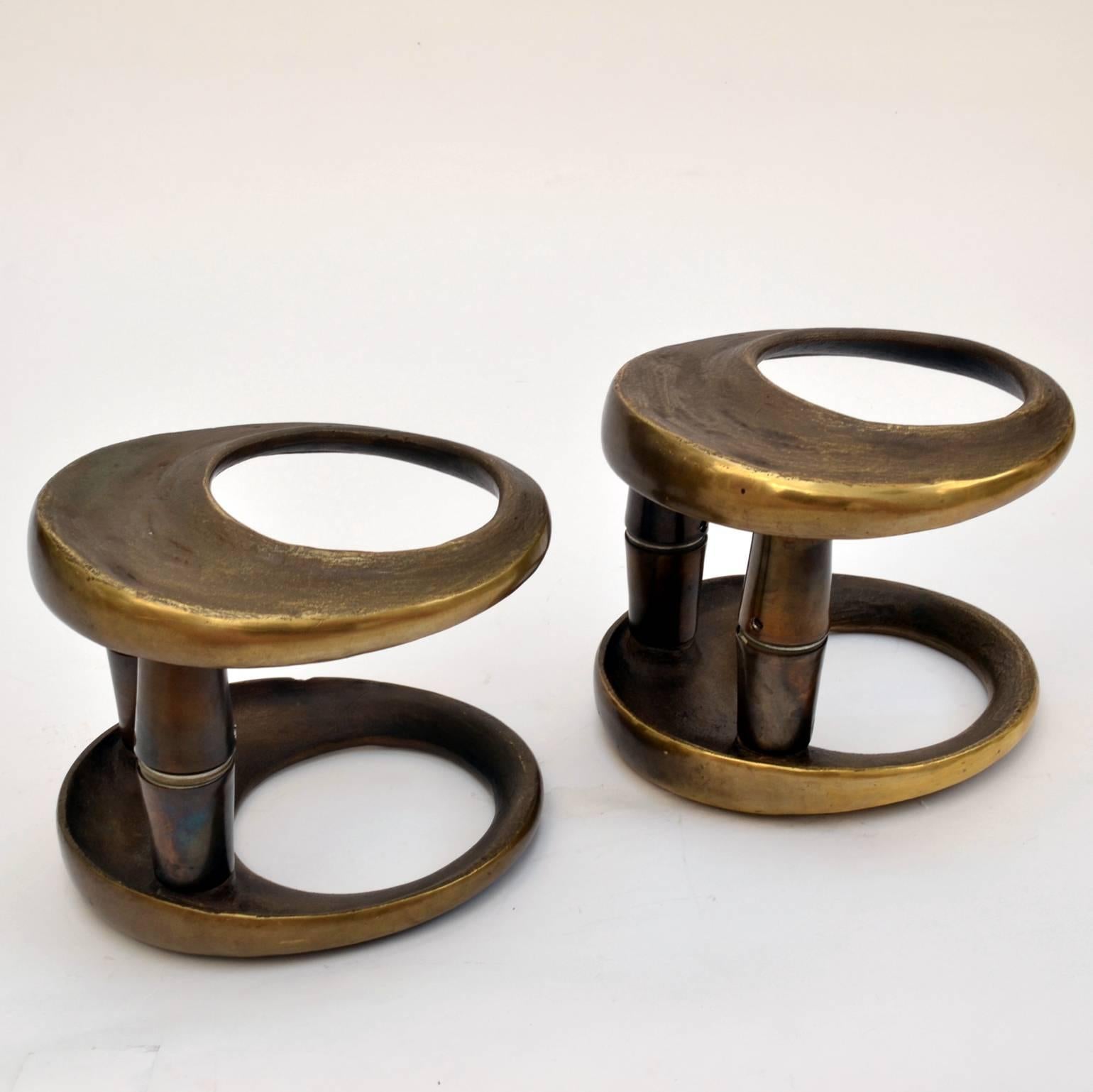 Unique double round bronze cast door handles with a textural relief
and dark patina. They are designed for push and pull doors and are suitable for glass doors.