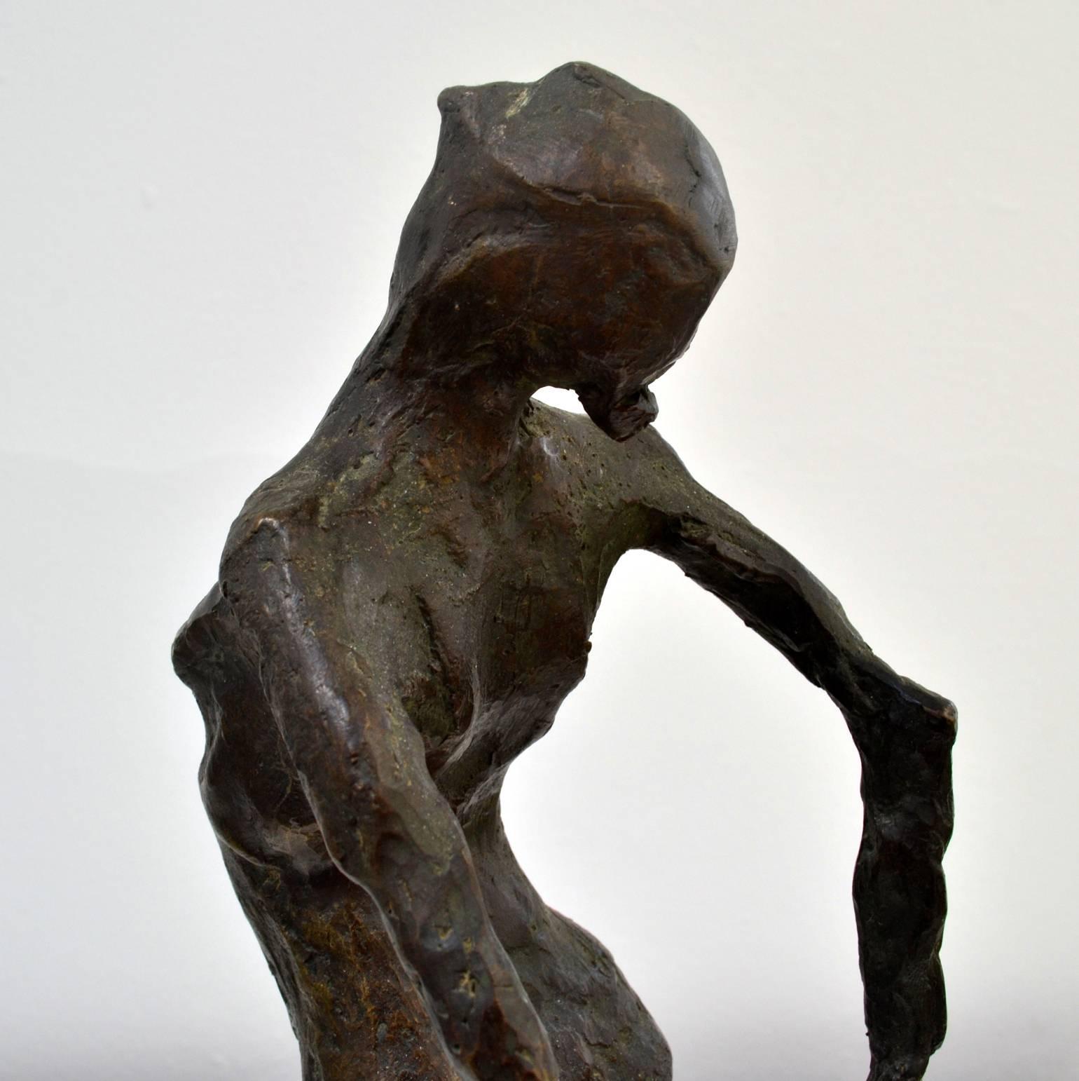 Bronze cast female nude dancing figure placed on a green marble base is made by the Dutch artist M.Frijling.
The tactile and rough surface of the figure and the elongated and heavily worked arms and legs emphasis on the dynamic movement of the