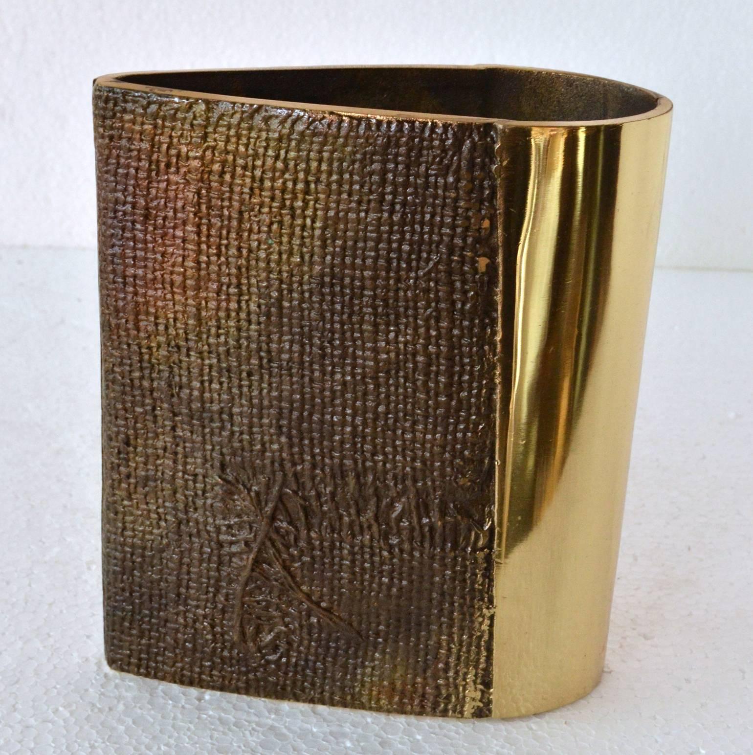 Sculptural vase with the texture of burlap imprinted in part of the vase contrasted with a high polished sheen. The vase is part of a group of high quality cast  items we present by Antonella Caprio 
Saviato made in the 1970s.
