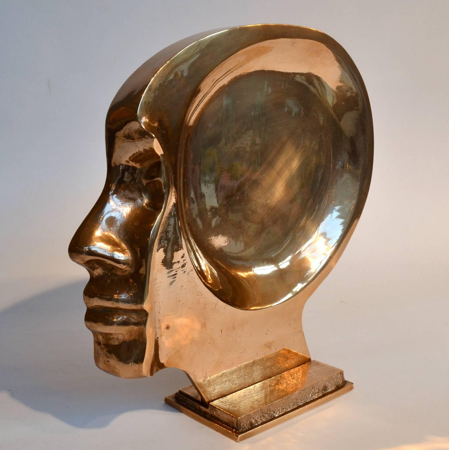 Sculpture of face in silhouette that that becomes a tray when taken of its stand becomes quite surreal. It is cast in bronze and has a high polished finish. It is made in limited edition of 100 signed Raf Verjans. Raf is a Belgium artist, born in