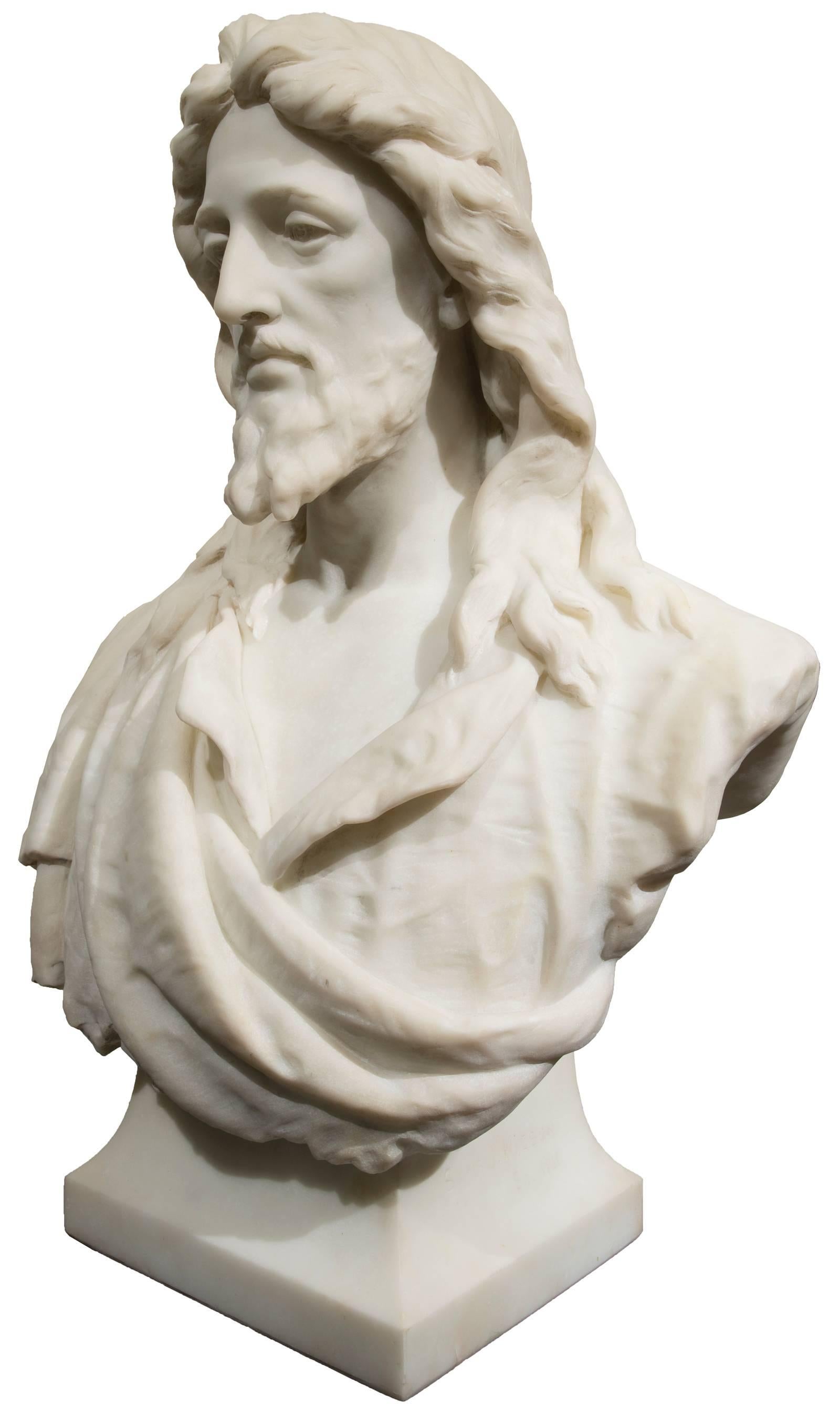 Christ is shown with His head tilted slightly to the right and a sombre downward gaze, stylized hair falling in long waves on the shoulders and folds of His tunic. The deeply carved white marble lends to the highly representational element of the