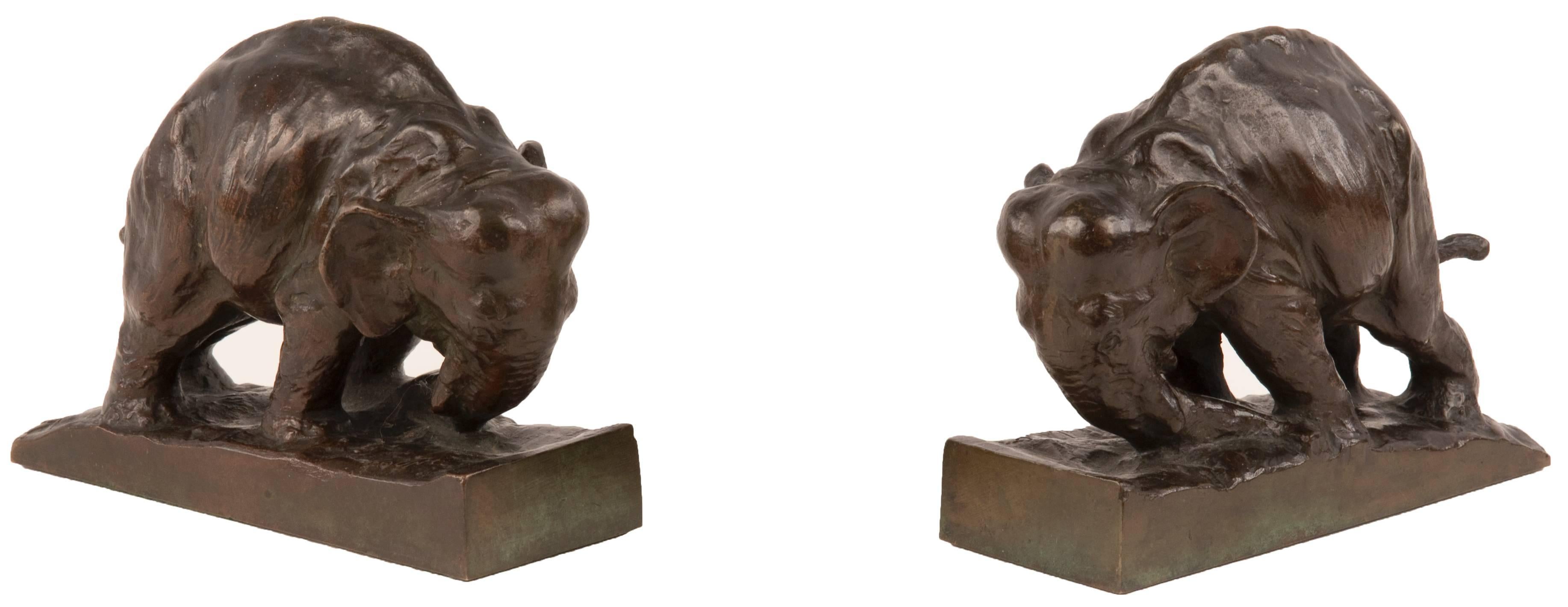 This pair of elephant bookends are cast in bronze with brown patina, and top of base incised with 
