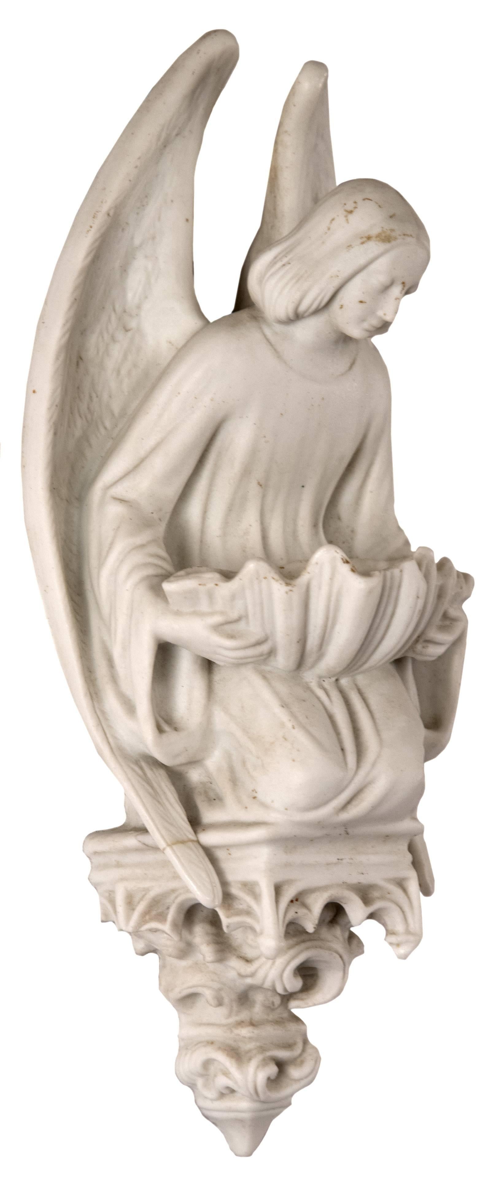 Kneeling on a dais, with wings encompassing their body, an angel with bowed head looks toward a shell-shaped font that they hold resting upon their lap. It is sculpted to denote the texture of the wings, the gentle folds of the drapery, and the