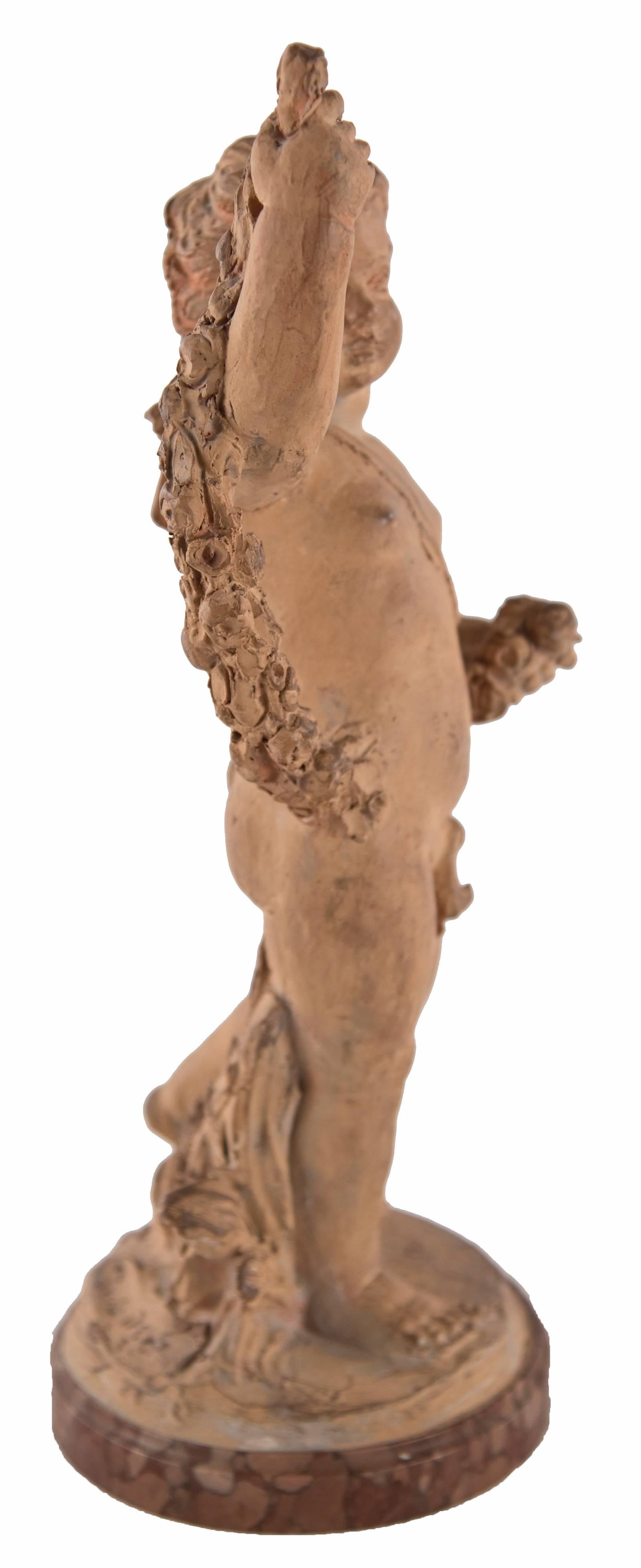 A terracotta figure in the form of a cherub, arm raised with floral garland on a round marble base. The organic, free-formed figure may be a preparatory study for a larger sculptural piece.

Base inscribed "Paris 1735".
 
