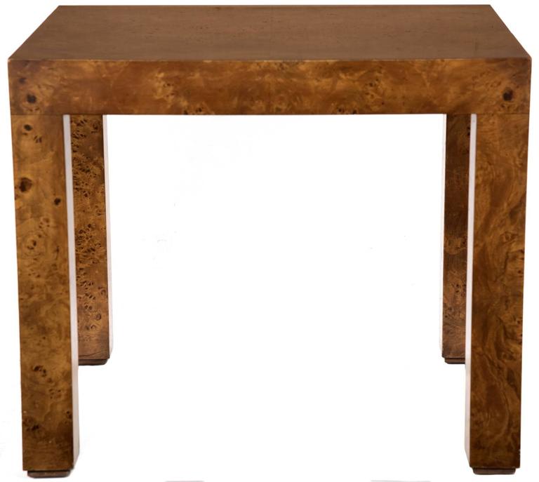 Mid-Century Modern rectangular burl walnut Parsons side table. The Parsons table is one where the square legs have the same width as the tabletop, regardless of its other dimensions.

The Parsons table was created in a furniture design class at