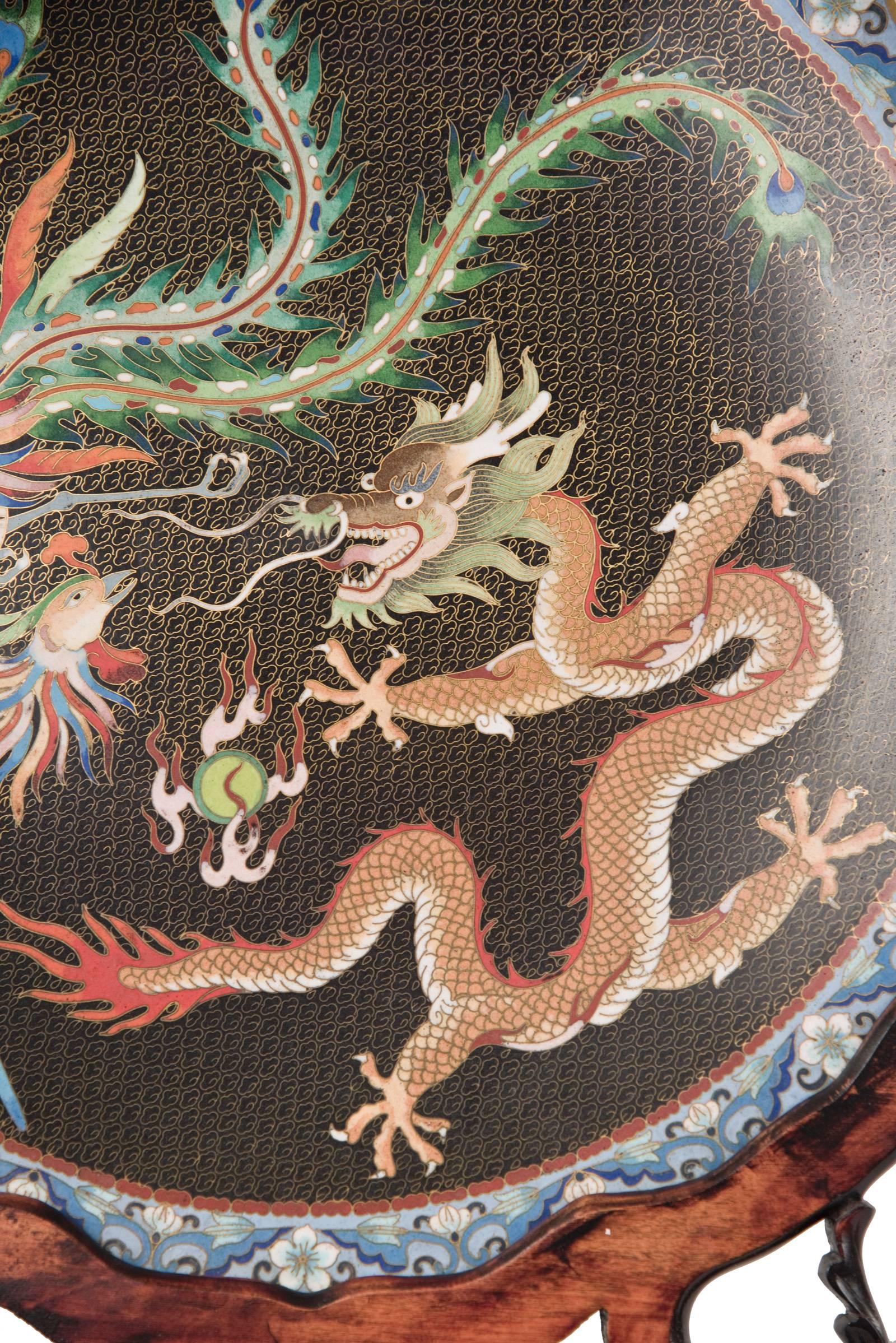 Cloisonné Enamel 'Dragon and Phoenix' Charger on Ornate Wooden Stand In Good Condition In Salt Lake City, UT