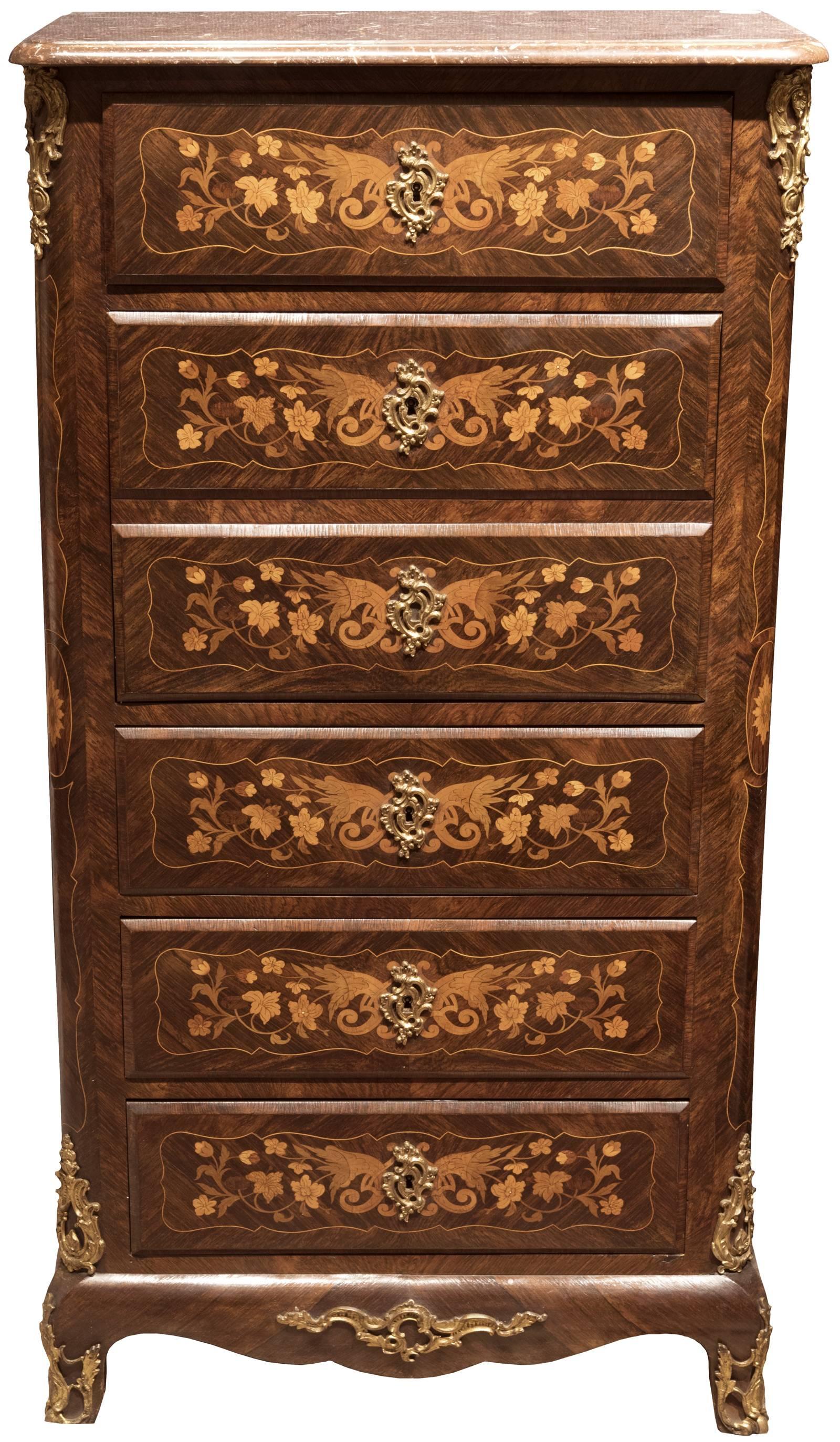 A beautiful French, Louis XV style kingwood fall-front writing desk with floral marquetry and ormolu mounts and drawer pulls. The secrétaire interior features the fall enclosing four inlaid drawers and an open shelf, with a gold-trimmed grey leather