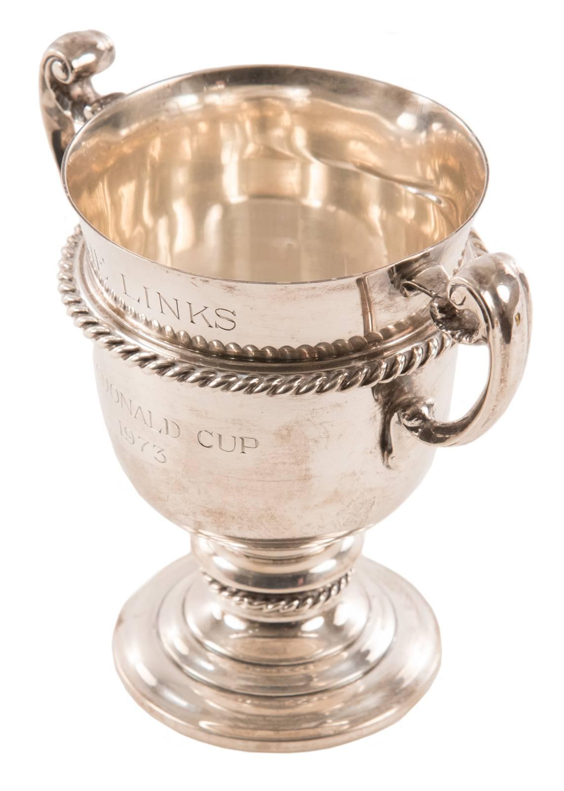 Sterling silver trophy cup, having urn shape flanked by two handles, inscribed, 