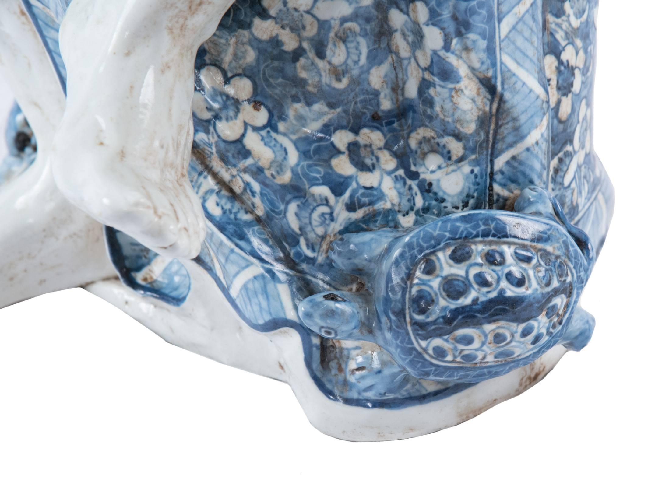 Chinoiserie Blue and White Chinese Porcelain Man and Fish Sculpture