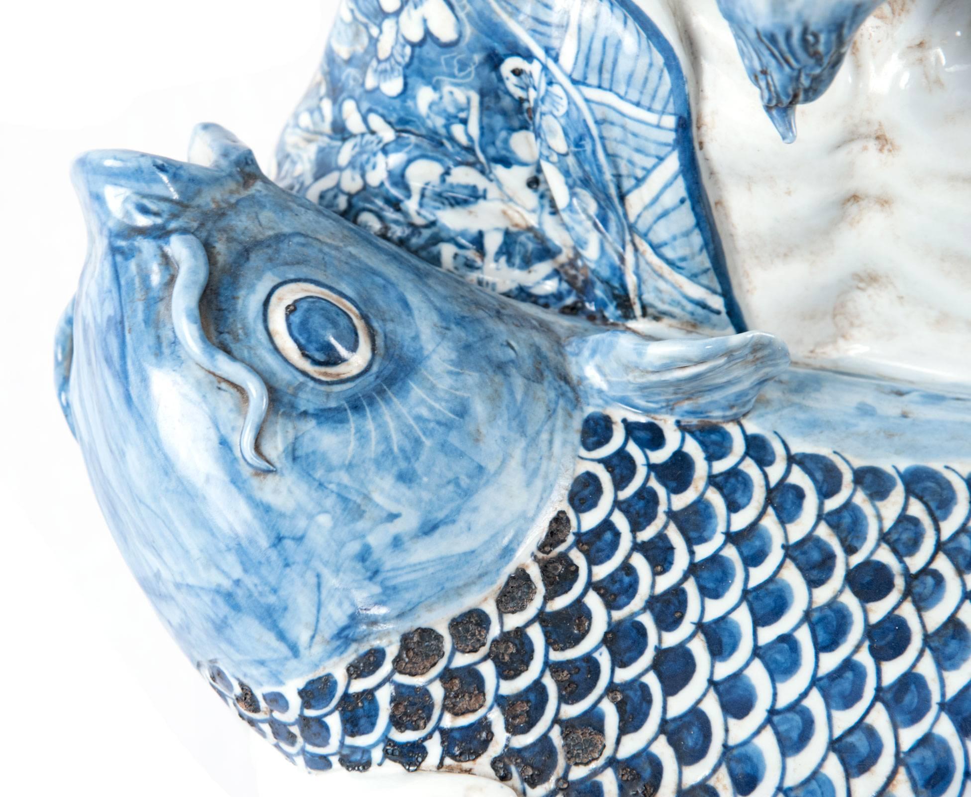 Blue and White Chinese Porcelain Man and Fish Sculpture In Good Condition In Salt Lake City, UT