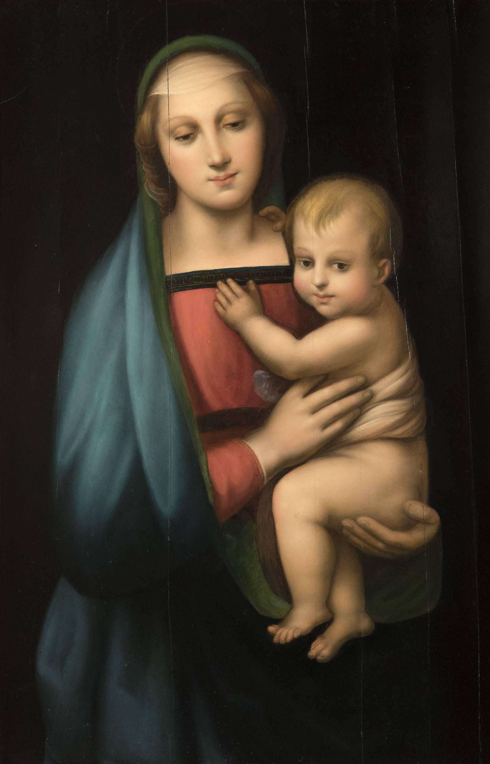 An unsigned 19th century copy of Raphael's Madonna del Granduca, painted on a wood panel that is cradled in the original carved giltwood frame with acanthus leaf motif. The original painting by Raphael (1483-1520) dates from c.1505 and is in the