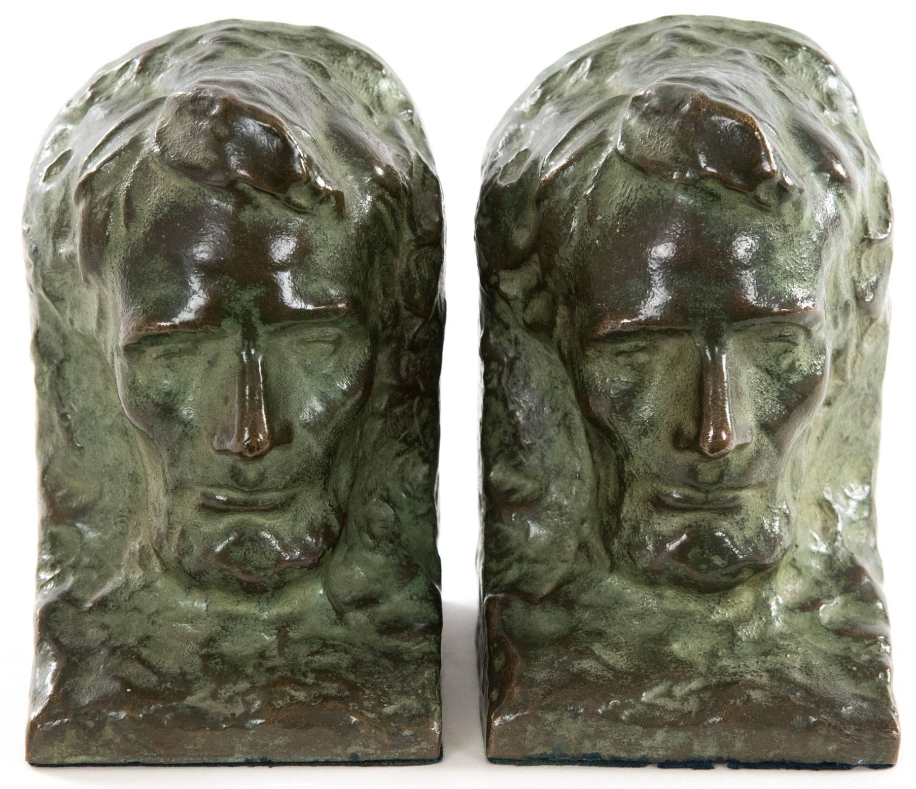 A pair of cast bronze bookends depicting the head of Abraham Lincoln, after the original model of Lincoln for Mount Rushmore by American sculptor Gutzon Borglum (American, 1867-1941). The back of each bookend is inscribed, 1936 the original mold of