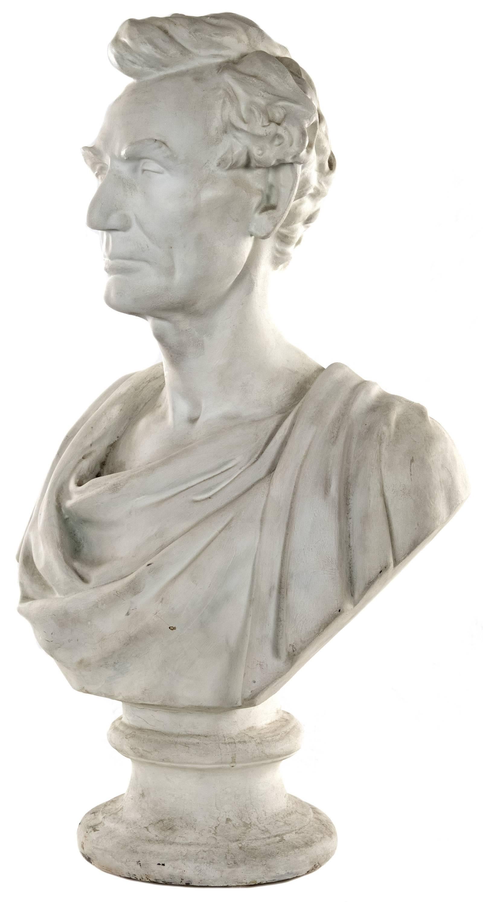 A 19th century white plaster bust of Abraham Lincoln shown wearing drapery reminiscent of ancient Rome, and, significantly, a clean shaved face. The piece was masterfully cast by American sculptor Leonard W. Volk (1828 - 1895) and is mounted on a