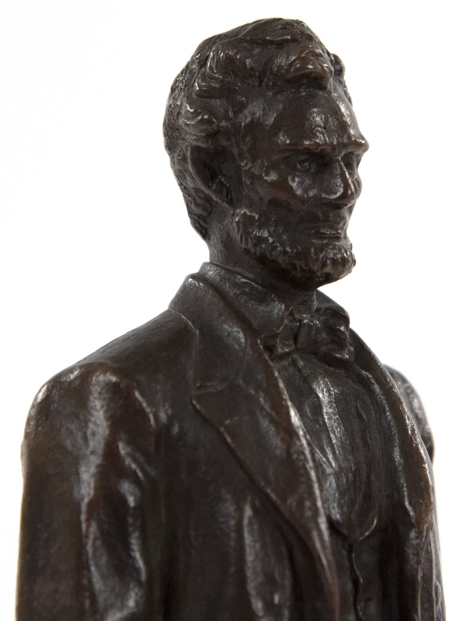 This bronze statuette of Lincoln, shown holding the emancipation proclamation in his right hand, by American sculptor George E Bissell (1839-1920), is modelled after the life-size monument element on the Scottish-American Soldiers Monument in