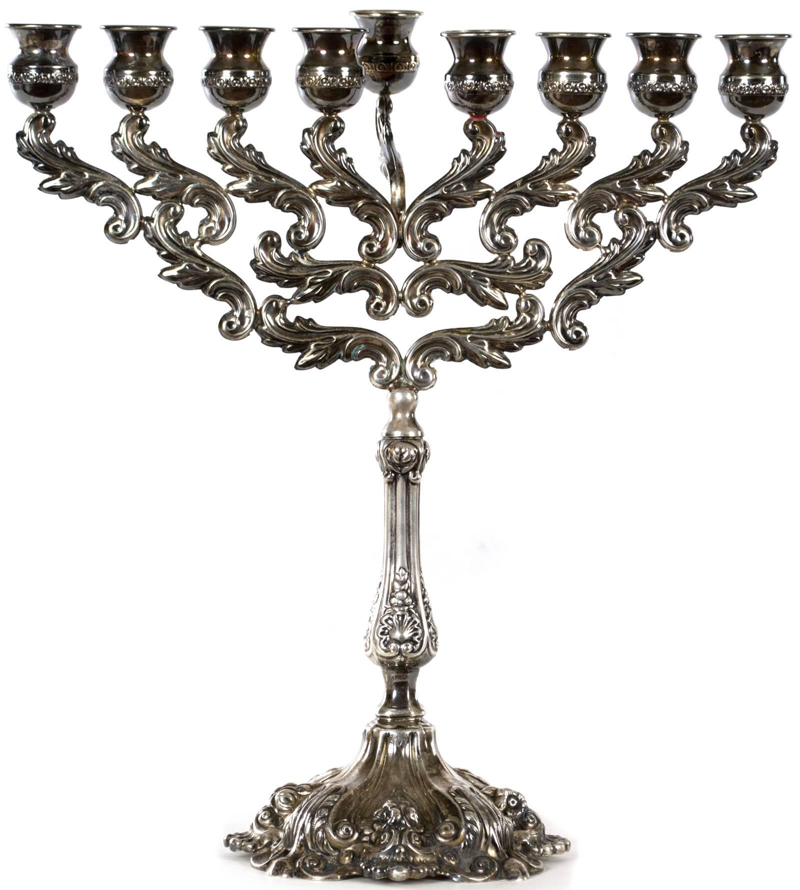 A beautifully cast and hand-chased menorah, decorated with acanthus leaves, shells, and s-scrolls made during the third quarter of the nineteenth century.