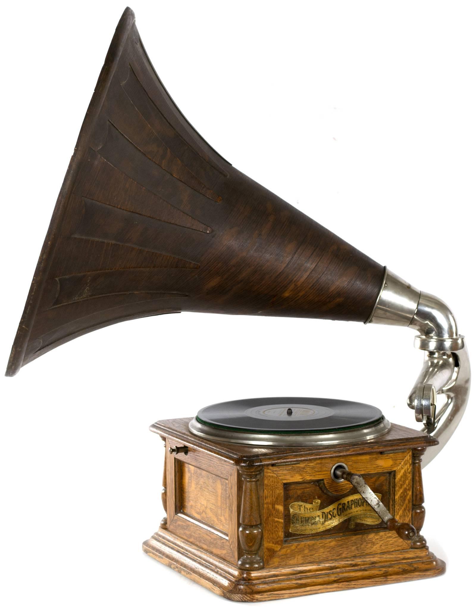 A 1904, BI Model of the Columbia Graphophone record player, with a very fine, carved-oak horn. The player is in fine working condition, and produced a warm sound.