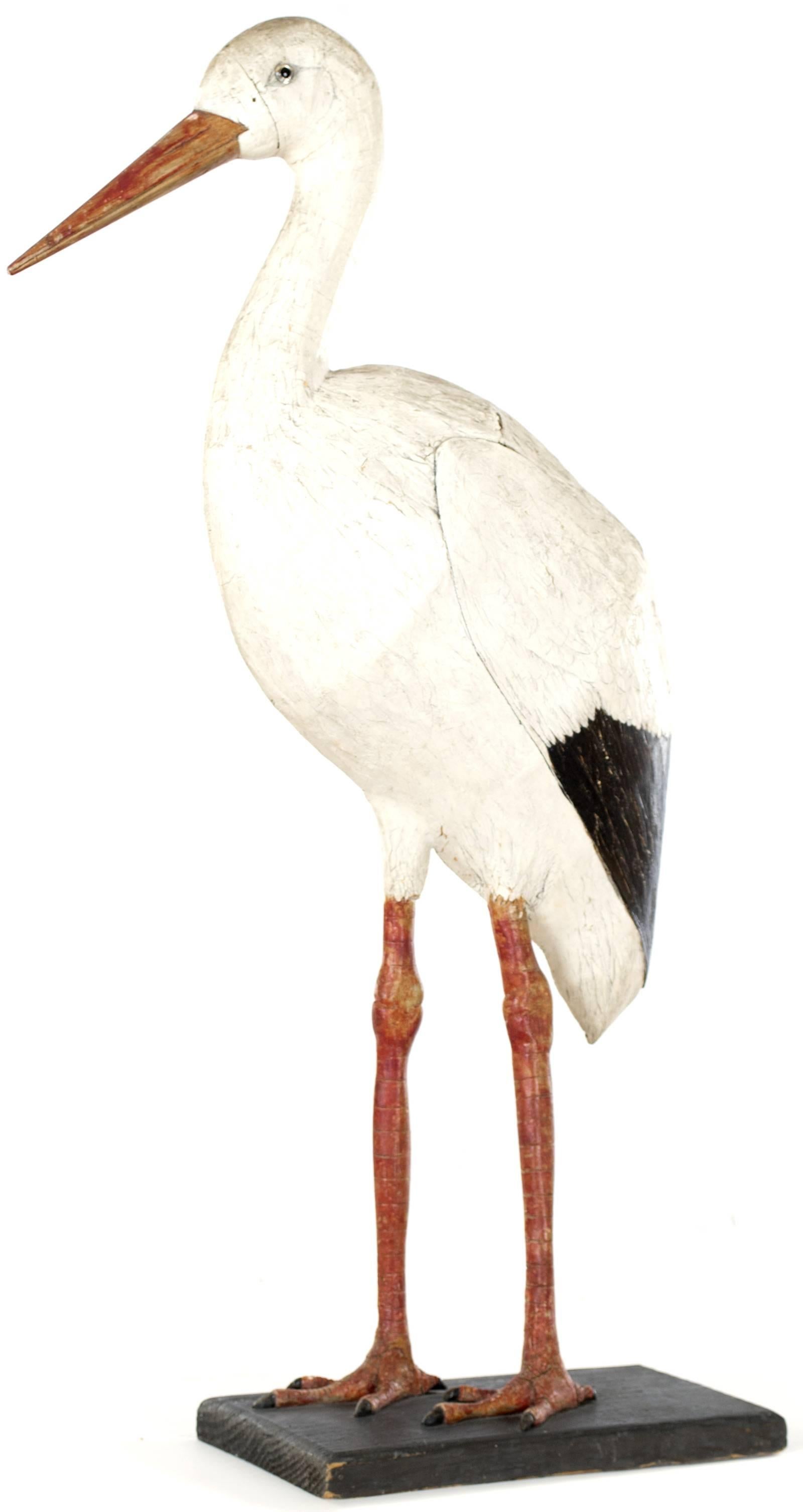 A very finely made, life-sized sculpture of a stork, carved in wood and beautifully painted in lifelike colors. Writing on the reverse in German reads: 