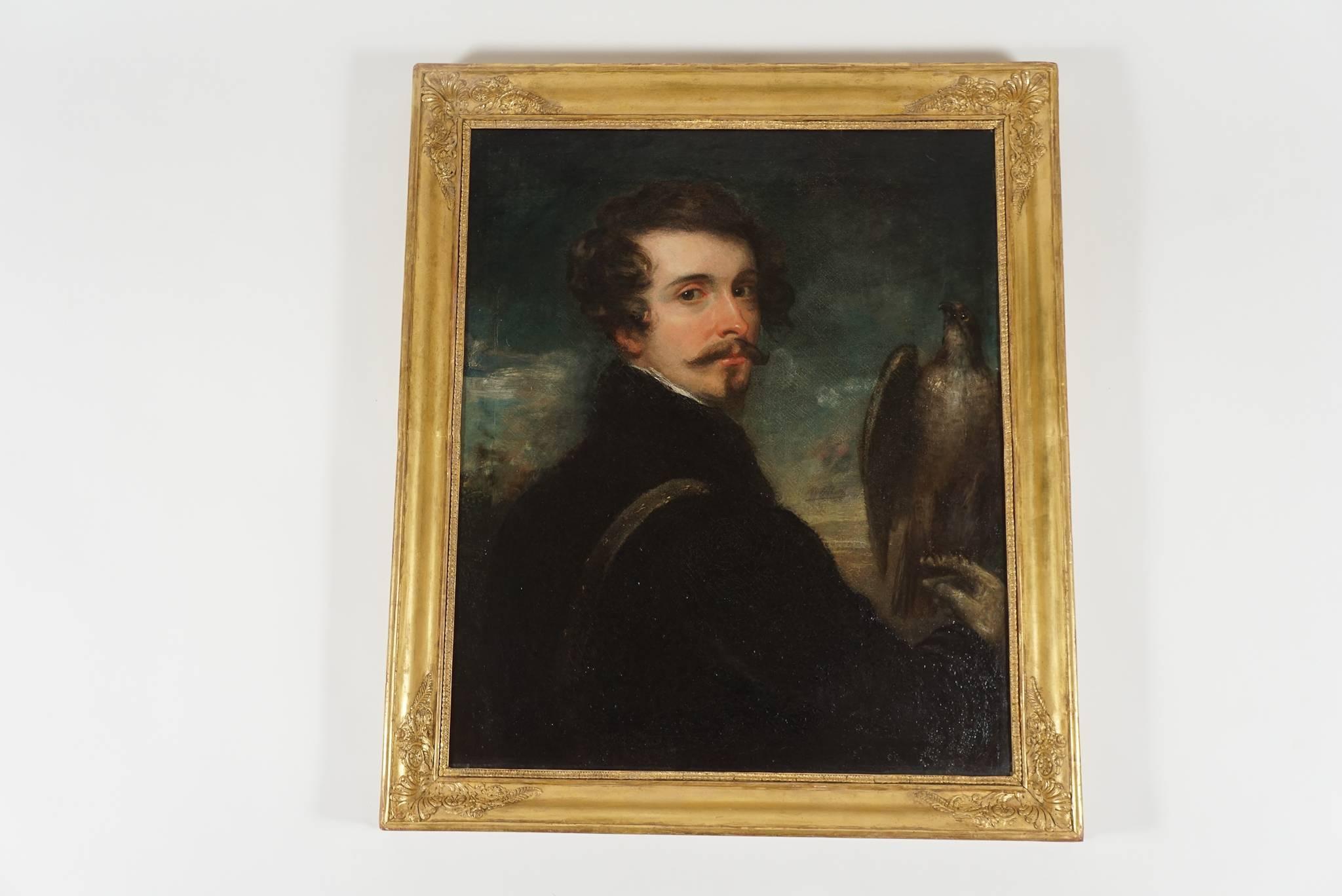 An elegant, circa 1830 German Romantic School oil on canvas portrait painting of a handsome gentleman with a falcon perched on right hand housed in original Empire giltwood frame.  Canvas measures 29.63