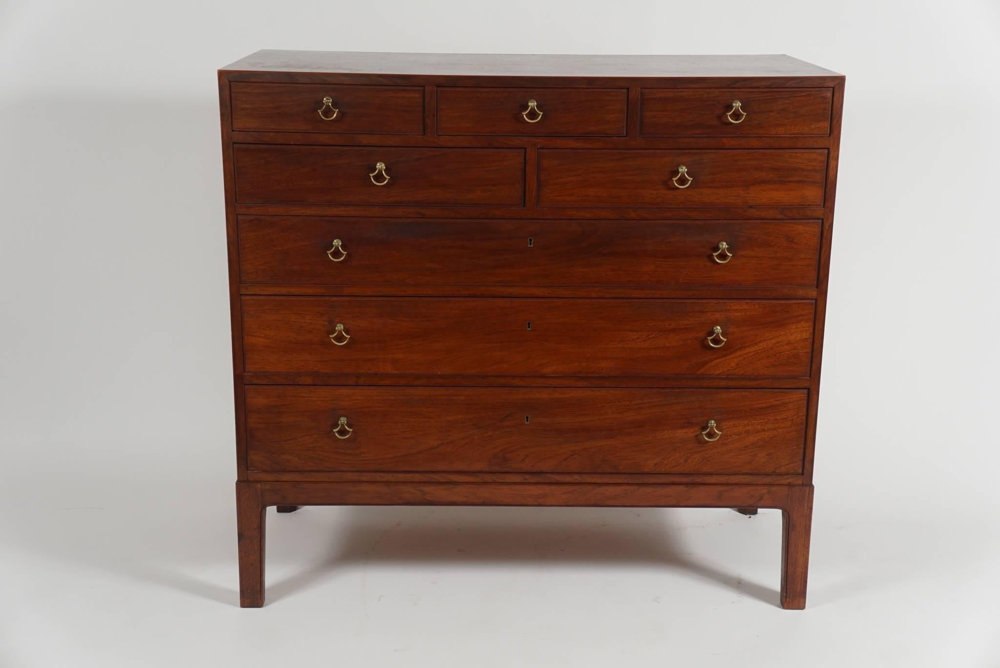Borrowing inspiration from two legendary cabinet-making traditions, that of the English Georgian period and the Chinese Ming dynasty, this elegant solid mahogany chest of drawers by important female Danish Mid-Century designer Birte Iversen,