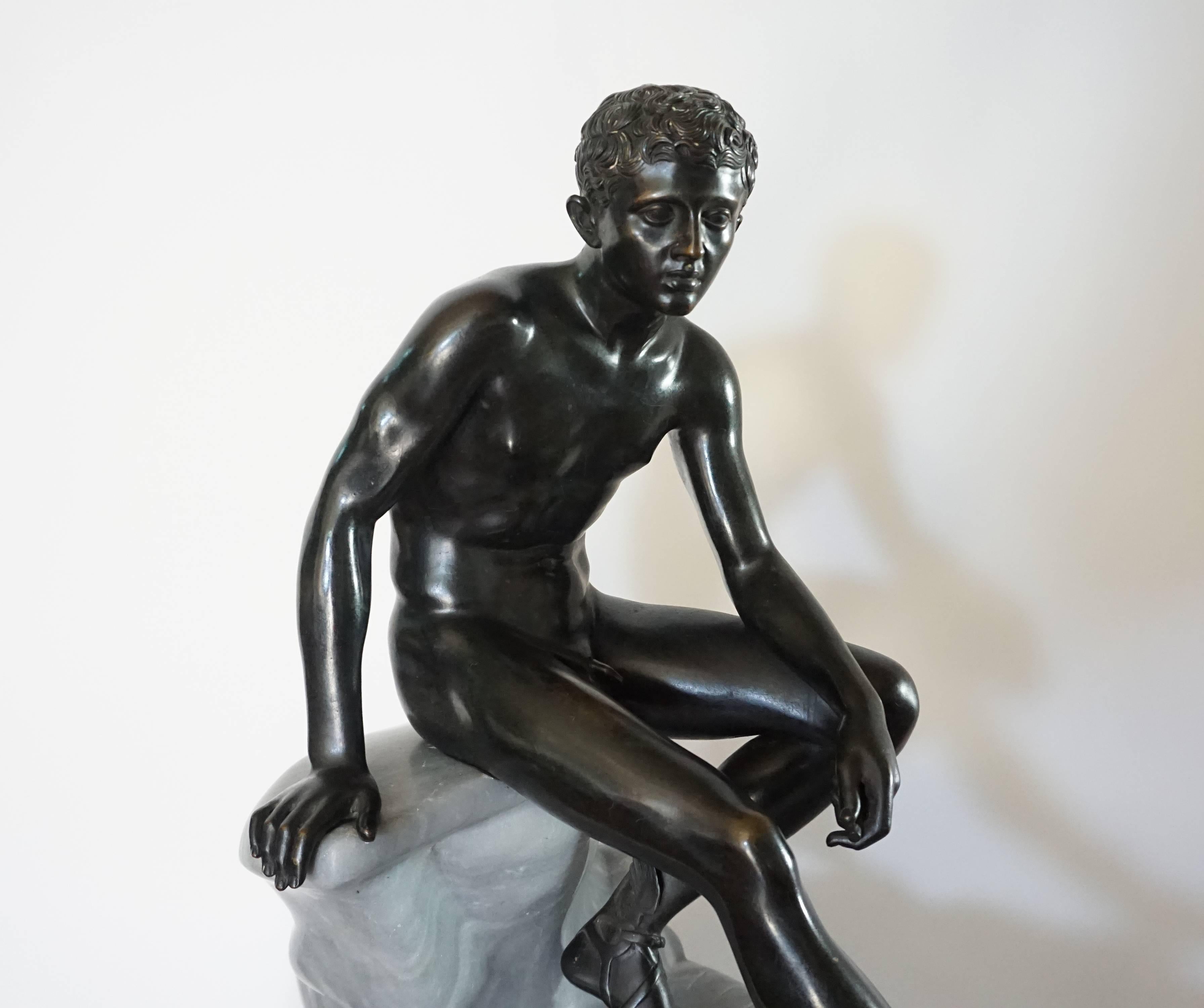 A large and exceptional late 19th century Italian Grand Tour sculpture of the ‘Seated Hermes’ attributed to the Chiurazzi Foundry, Naples, Italy. The solid lost-wax cast bronze figure seated atop a naturalistically carved Turquin Blue Bardiglio