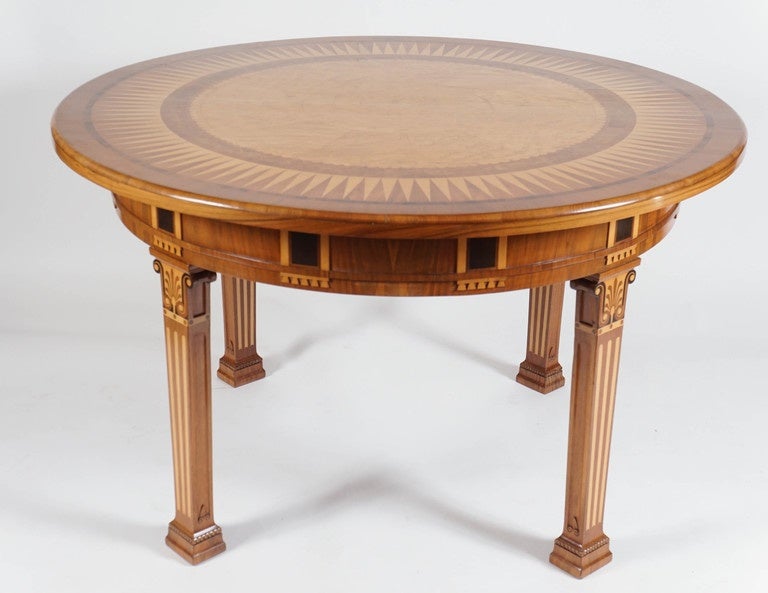 An exceptional circa 1930 Swedish Grace period specimen wood parquetry and marquetry center table of neoclassical design composed of satinwood, burled walnut, walnut, bird's eye maple, rosewood, ebony, mahogany, and elm wood veneers and inlay.  The