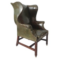 Fauteuil à oreilles en cuir de style George III, vers 1780