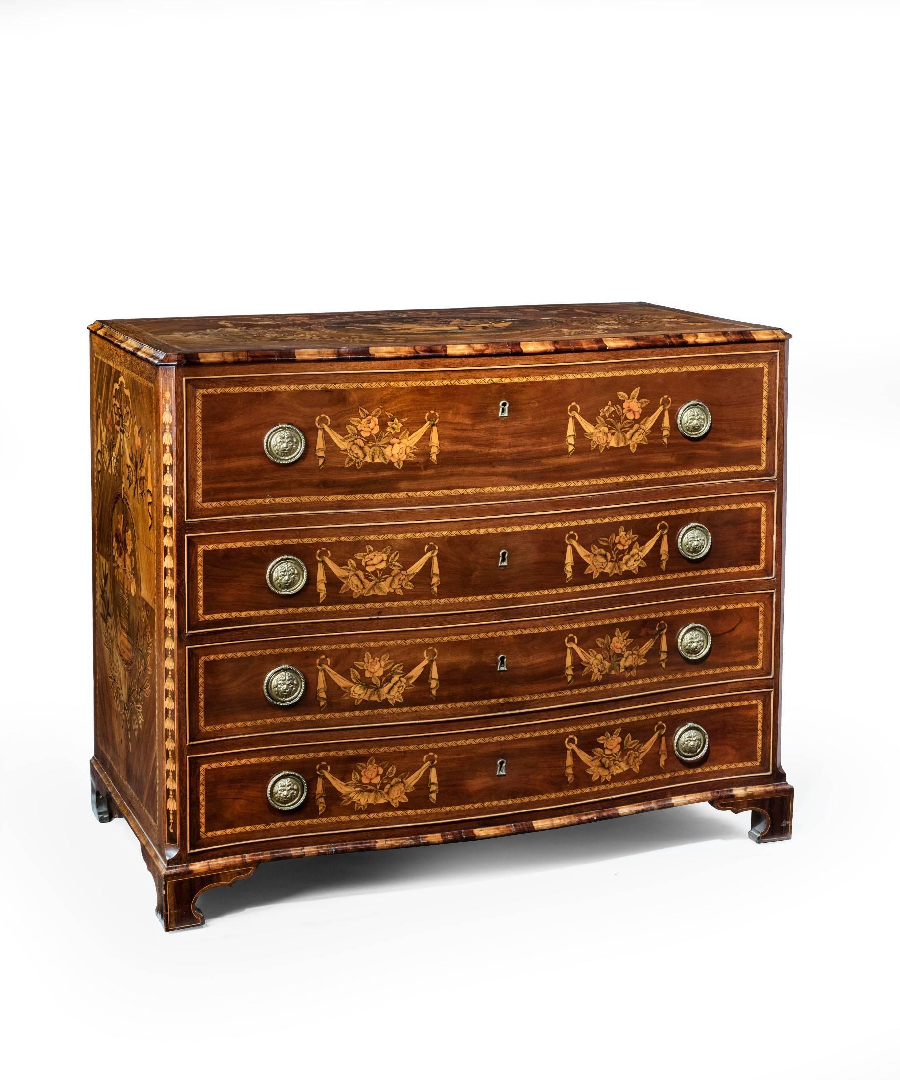 A magnificent pair of late 18th century continental walnut and marquetry serpentine fronted commodes, the top inlaid to the center with musical trophies (the other commode with military trophies) set within an oval laurel wreath border surrounded by