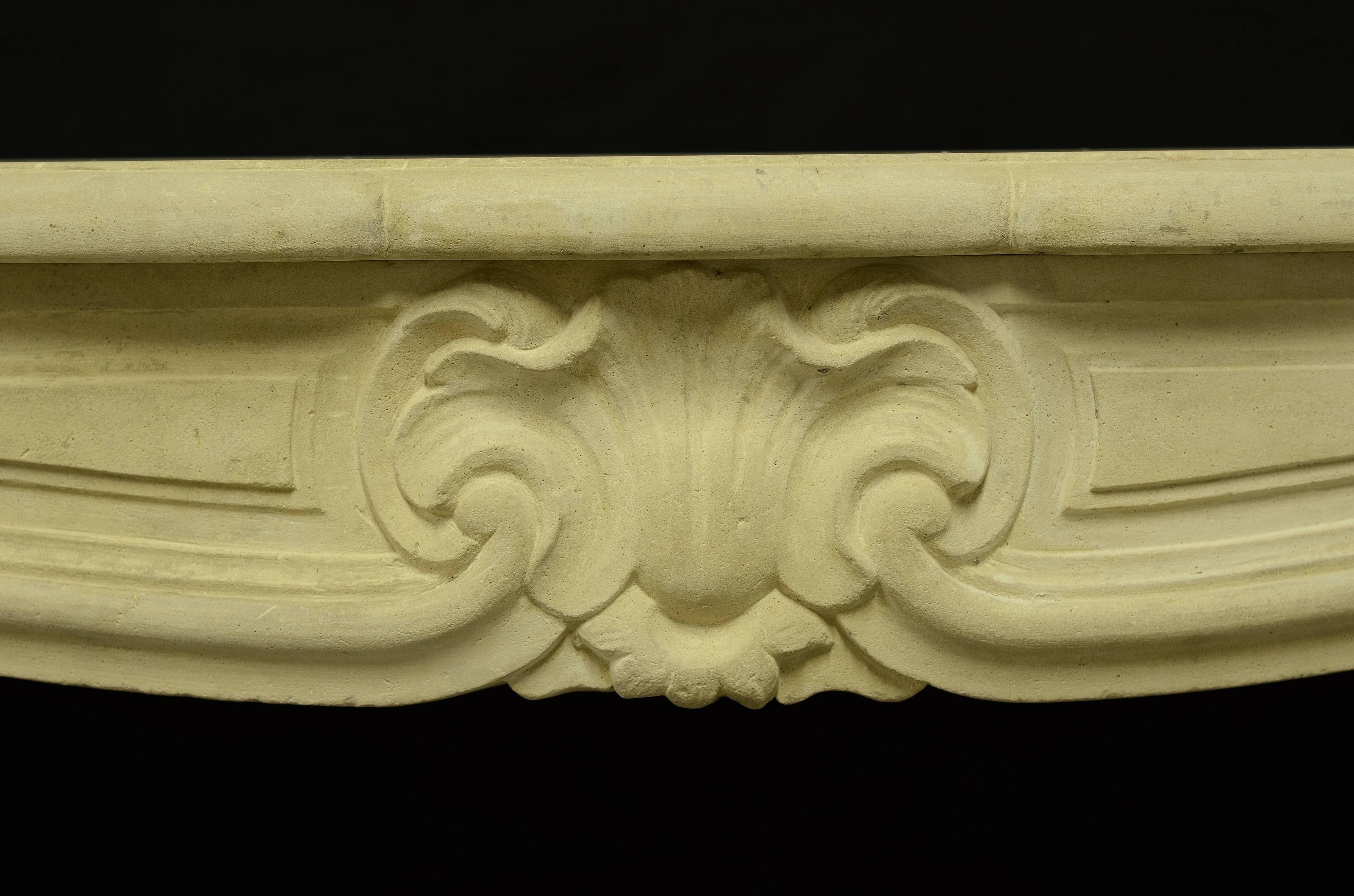 Very nice, small limestone Louis XV from France, 19th century.
Beautiful sweeping frieze with a very detailed and finely carved shell.

Opening measurements fireplace: 34.2 x 37.9 inch or 87 x 96 cm. (height x width).

Excellent condition,