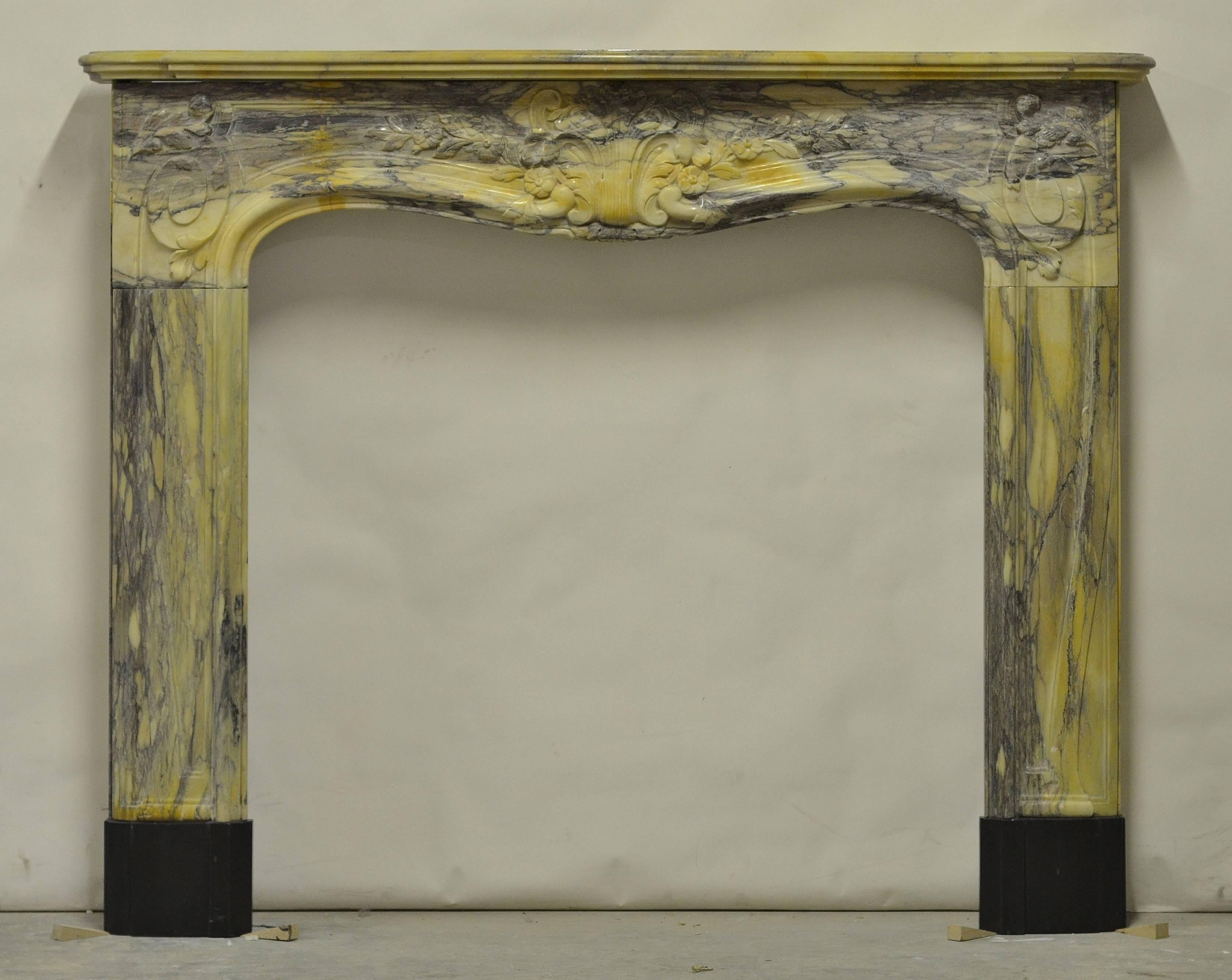 A very colorful and decorative Louis XV Fireplace.
The bright and warm marble really makes this mantel stand out.

Great condition but restored.
Contact us with any questions or requests, we are happy to help!