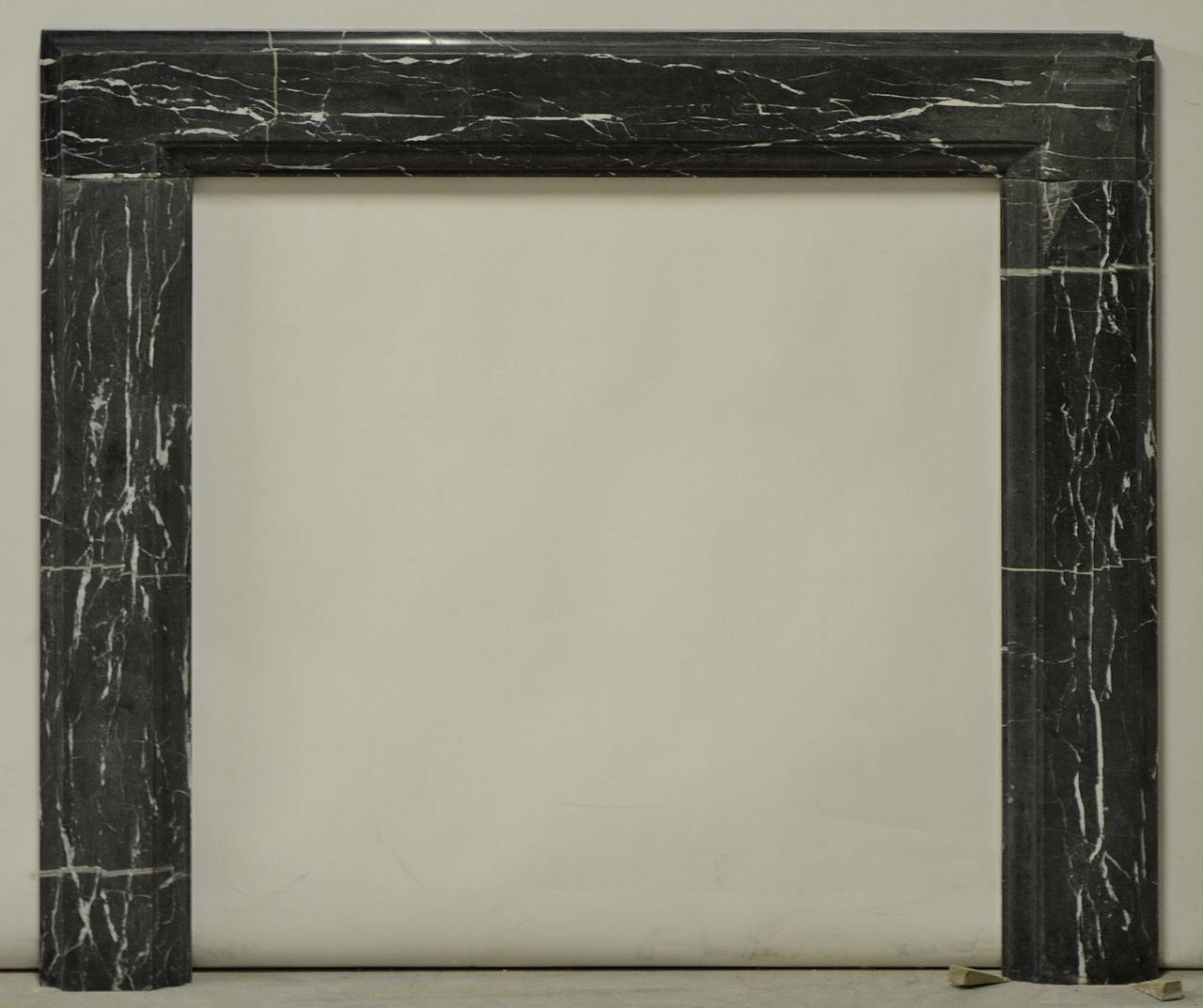 19th century, Bleu Belge marble bolection fireplace mantel. 

Opening measurements : 36.2 x 35 inch (height x width).

Has been restored, please see the additional pictures.