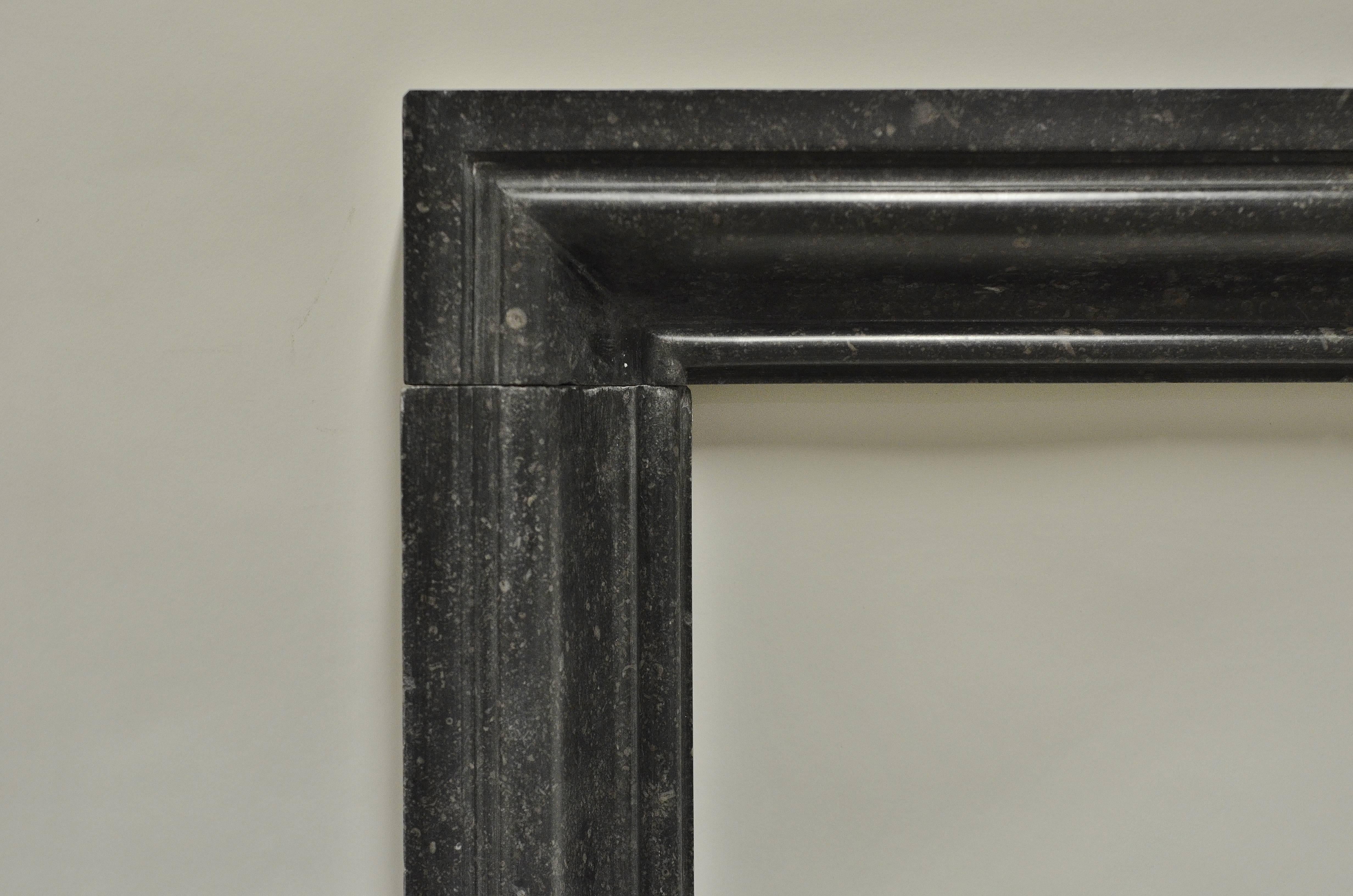 Lovely and small bollection fireplace mantel.

Opening measurements: 31.5 x 24.2 inch (height x width).