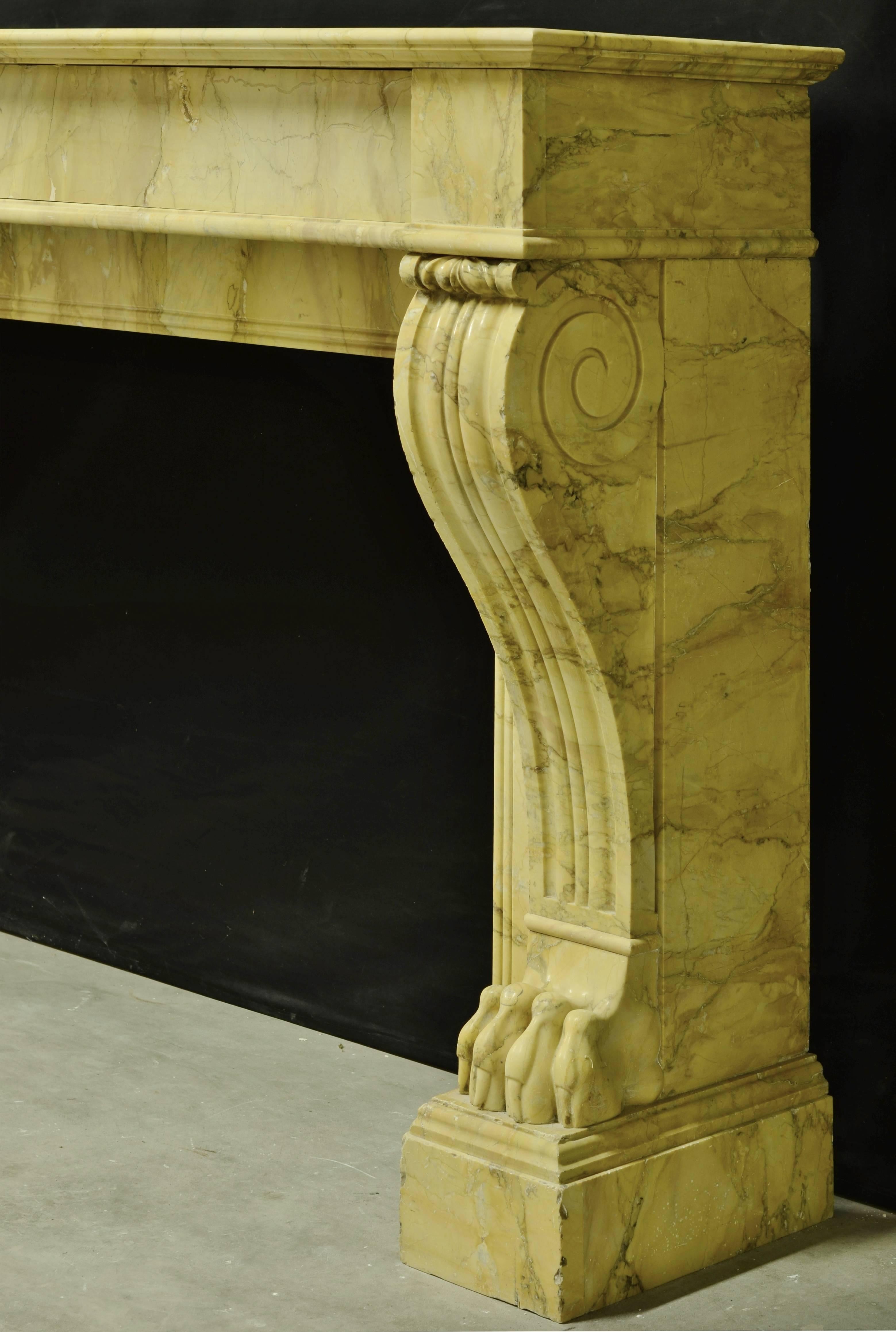 19th century French Napoleon III fireplace. Very nice C scrolled consoles ending in the claws of a lion.

Opening measurements: 28.7 x 39.7 inch (height x width).