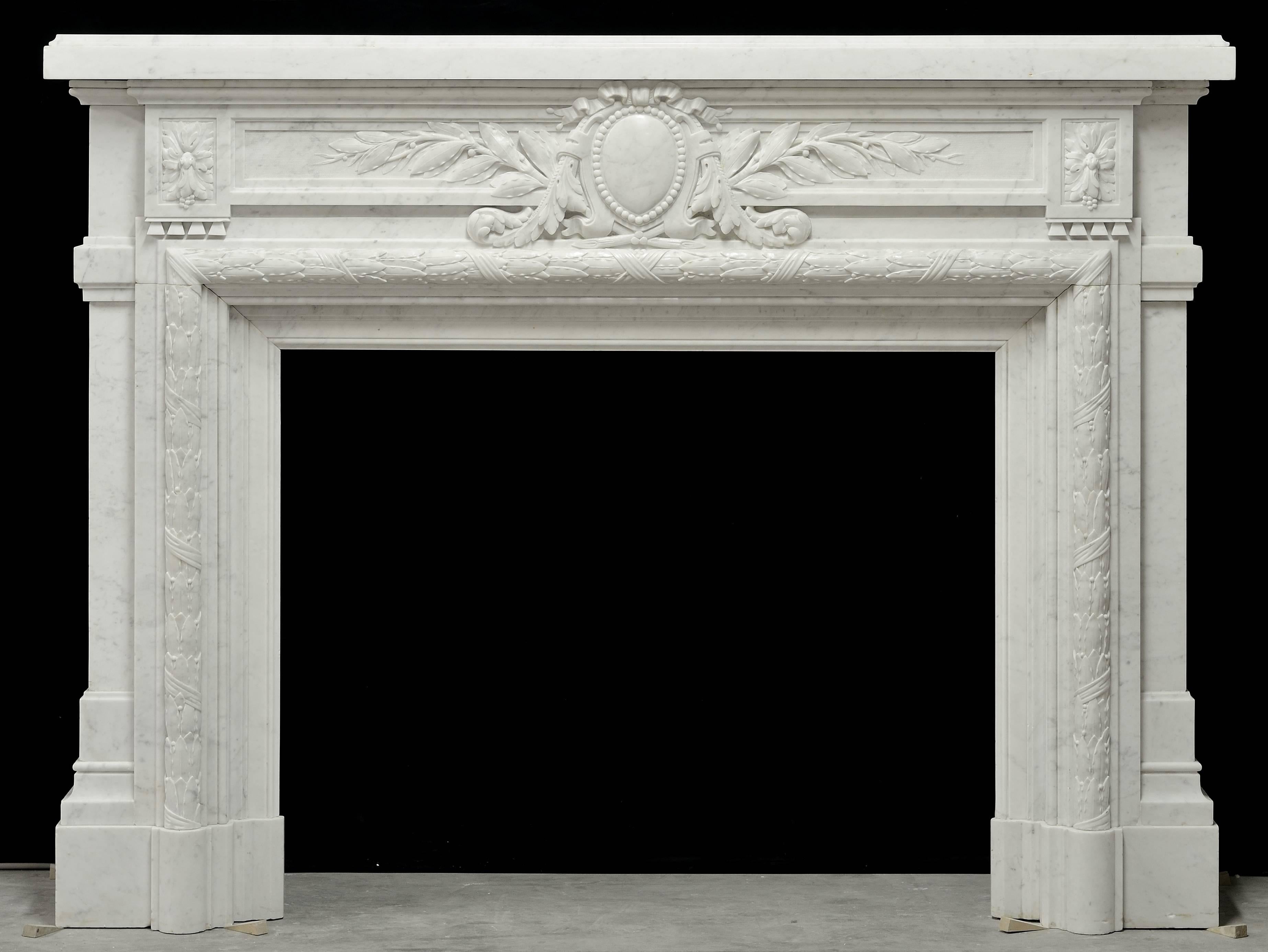 A beautifully carved and unique French Louis XVI style fireplace in Carrara white marble, 19th century.
Perfect, pristine condition. Ready to be installed.

Opening measurements: 36.02 x 44.09 inch. (91.5 x 112 cm) height x width.