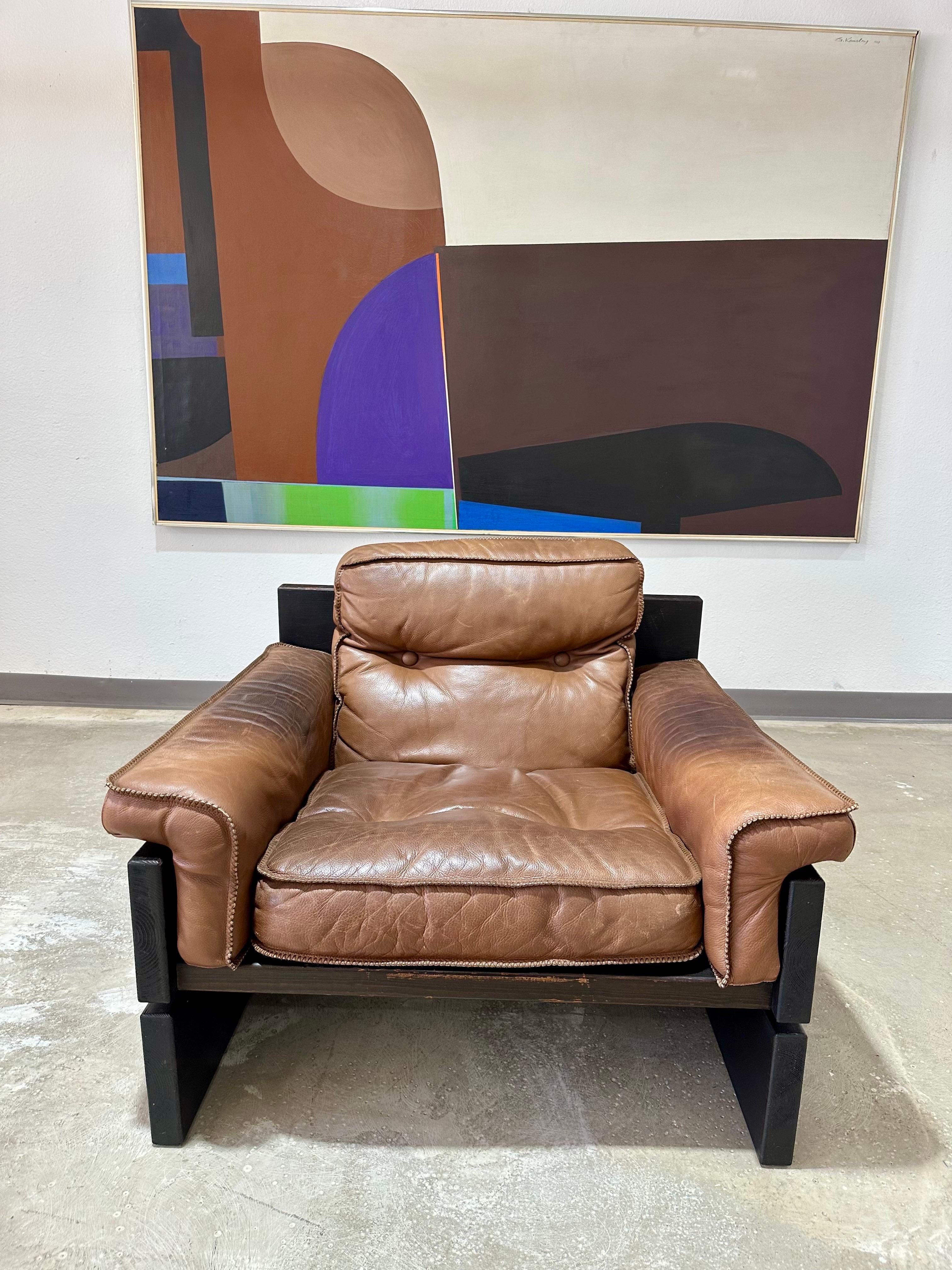 Vintage 1970’s Danish Brutalist Stained Pine and Brown Leather Sling Loveseat. Reminiscent of Brazilian Mid Century and Brutalist designs such as those by Percival Lafer. This unique and likely custom made low slung pine sofa is as beautiful as it