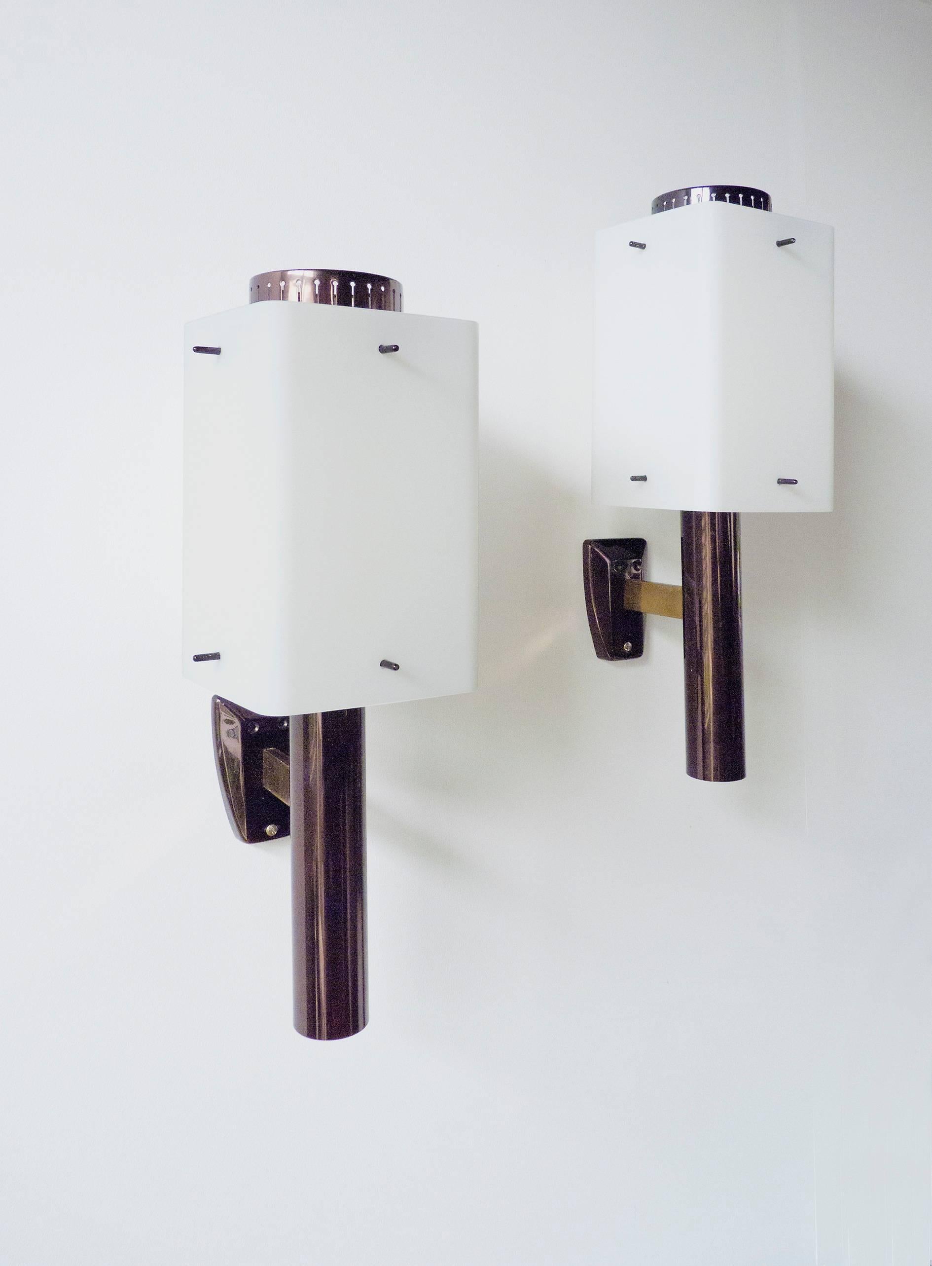 Large wall lights in lacquered and polished brass with opaline glass shades.
Stamp on the metal 'Stilnovo.'