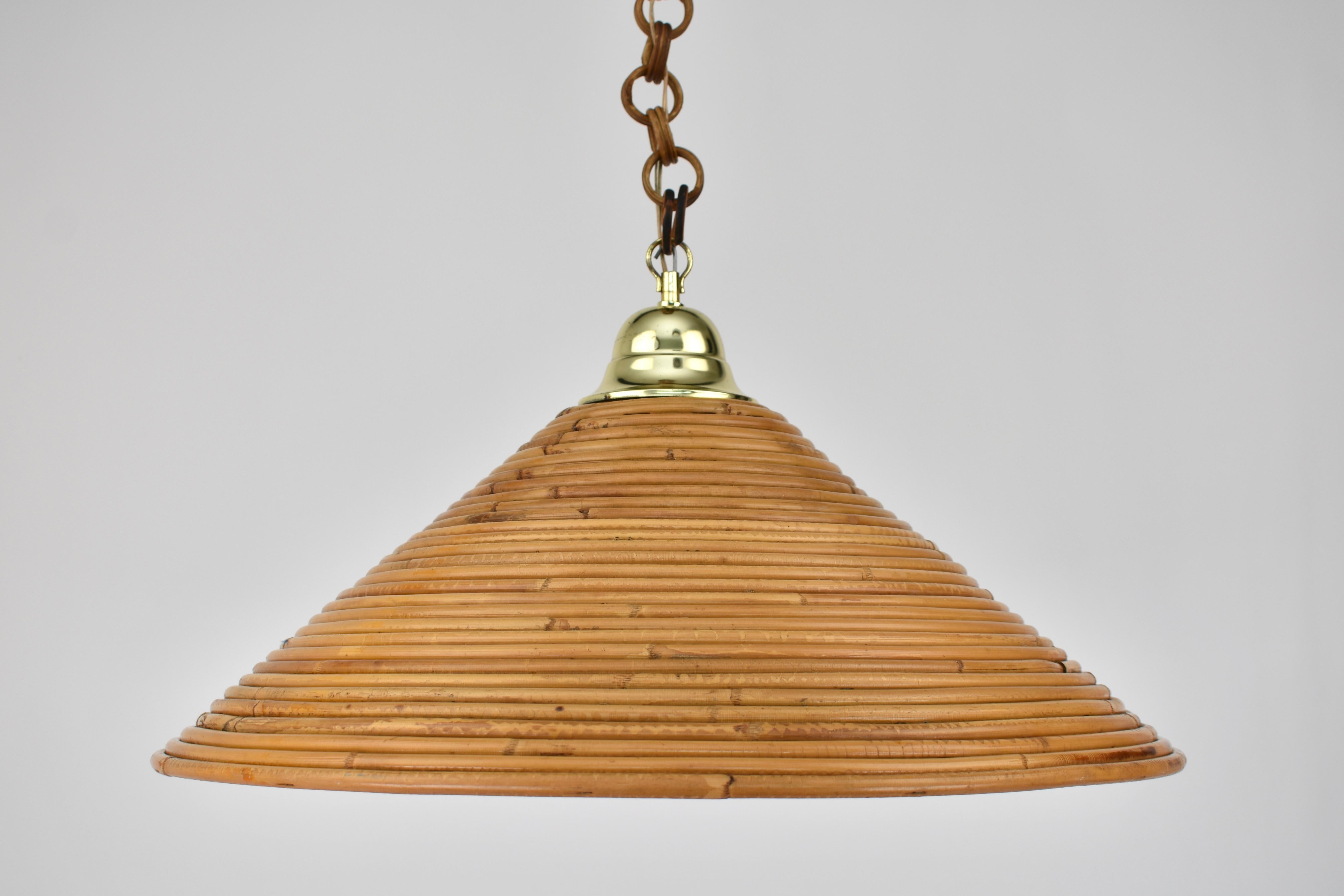 Beautiful authentic 1950s rattan pendant light, likely made by Vivai Del Sud. Handmade in Italy, this rare vintage piece features a beautifully woven rattan shade that exudes warmth, charm, and organic elegance.

Perfect for boho, coastal, or
