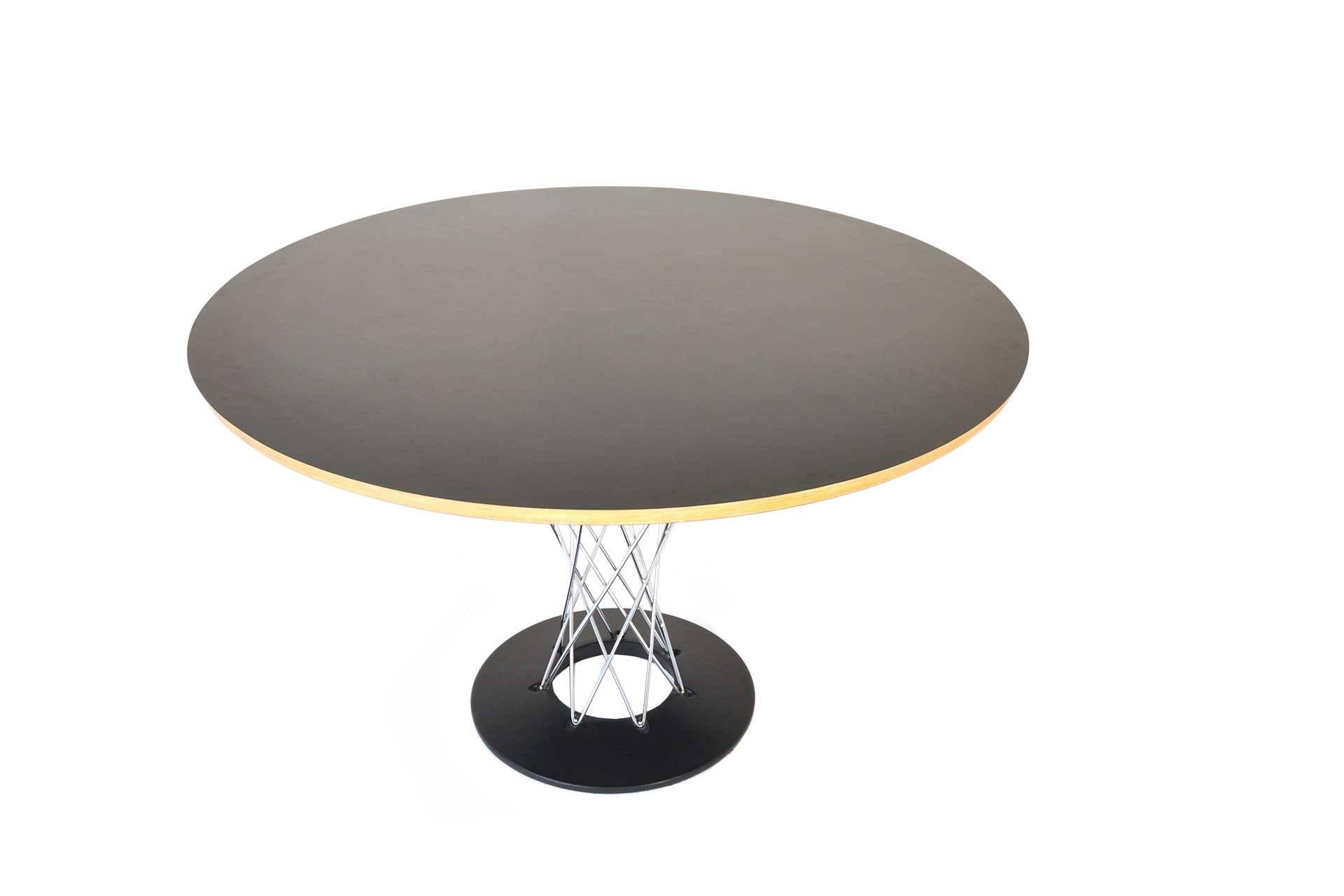 This table was designed by Isamu Noguchi in Switzerland in 1954. It was manufactured by Vitra in 1990s. The table top is made of plywood with hard covering. The feet is made of chromed steel wire and cast iron.