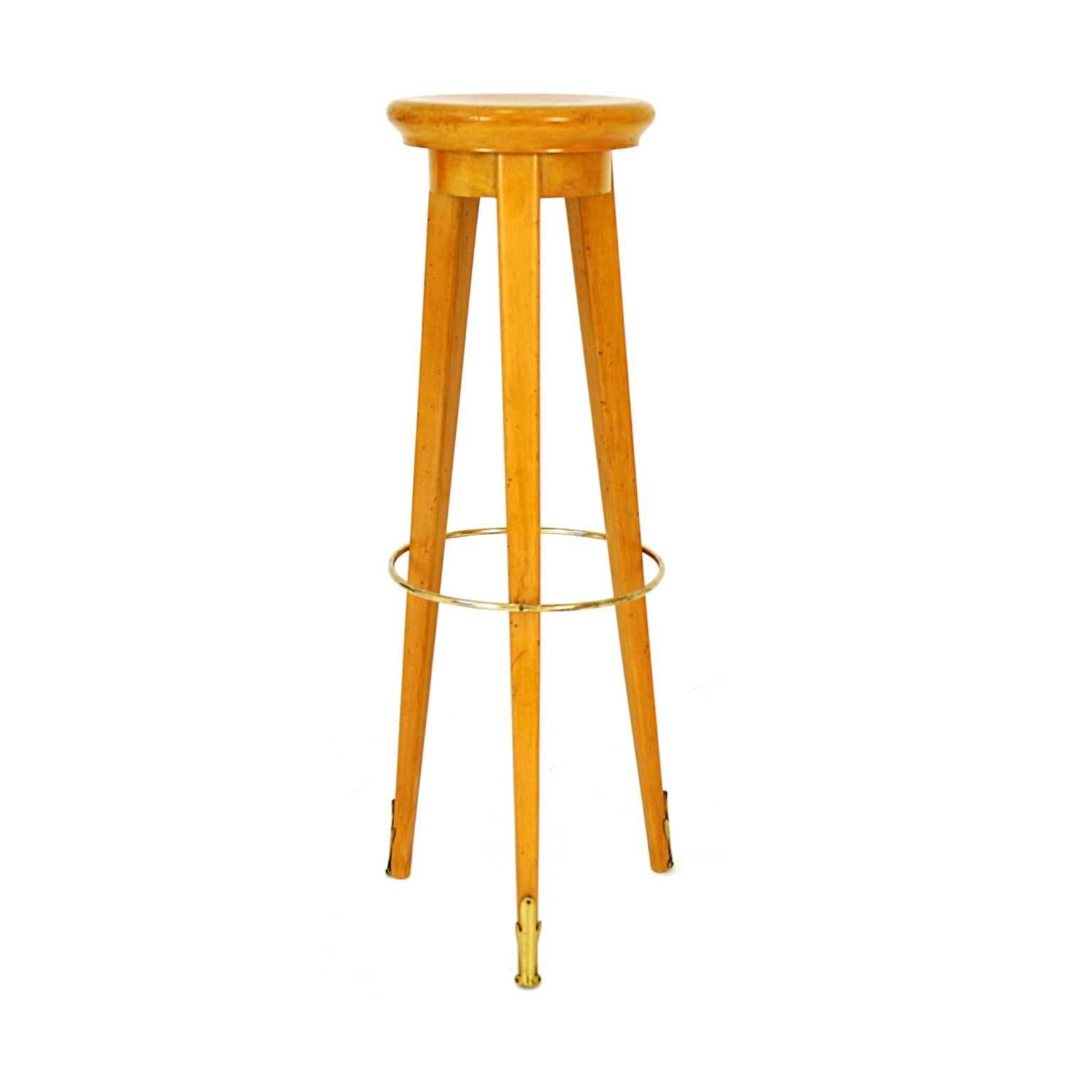 Both bar stools were made in 1950s in France. The item is made of maple. All of the details are made of brass. There are two pieces available.
