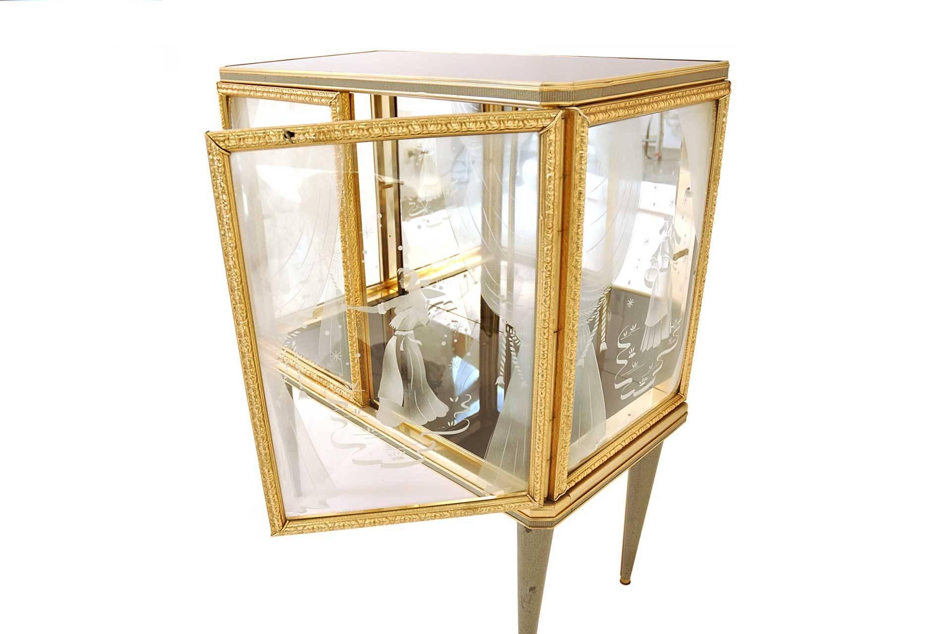 This piece was manufactured in Italy in 1950s. The furniture frame is made of lacquered sheet metal. The cabinet has etched and swelled glass. On the top of the piece there is new lacquered glass in black. The feet are covered with hammer blow