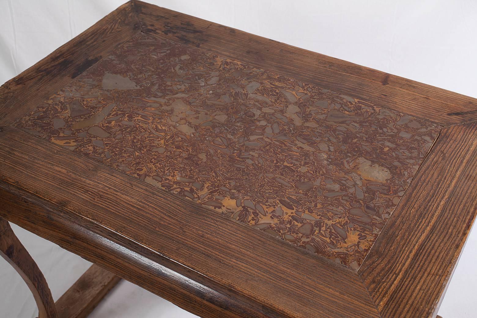 
This elegantly shaped Northern elm table is a great example of Shanxi province’s vernacular furniture. Shape and style suggest it was used as an offering table in front of a long altar table. 
The top frame houses a beautiful, over 4 cm thick