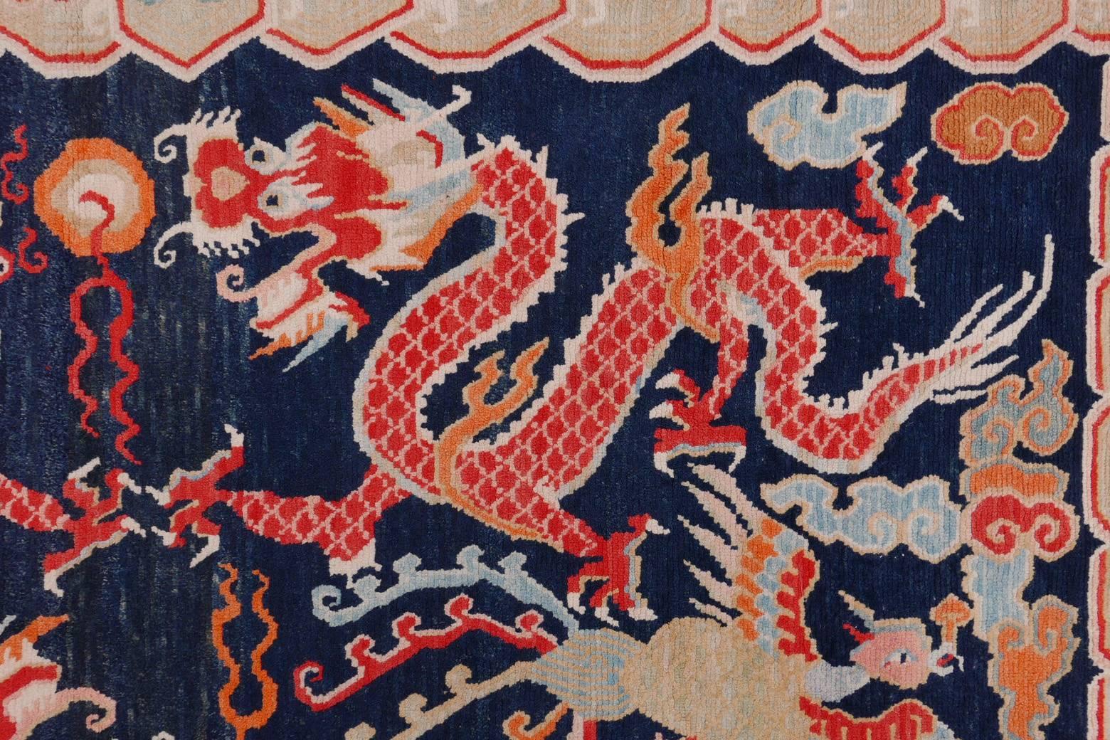 Provenance: Purchased from Theresa Coleman's Tibetan Gallery in the early 2000s.
This stunning all-natural dye Tibetan Khaden depicts two dragons playing with the pearl of wisdom and two phoenixes.
The dragons bodies are elegantly shaped with scales