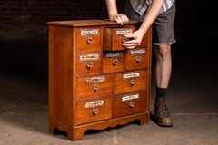 Antique Wooden Apothecary Cabinet with Labeled Drawers