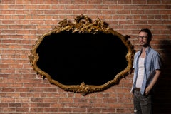 Antique Massive French Giltwood Mirror with Floral Crest