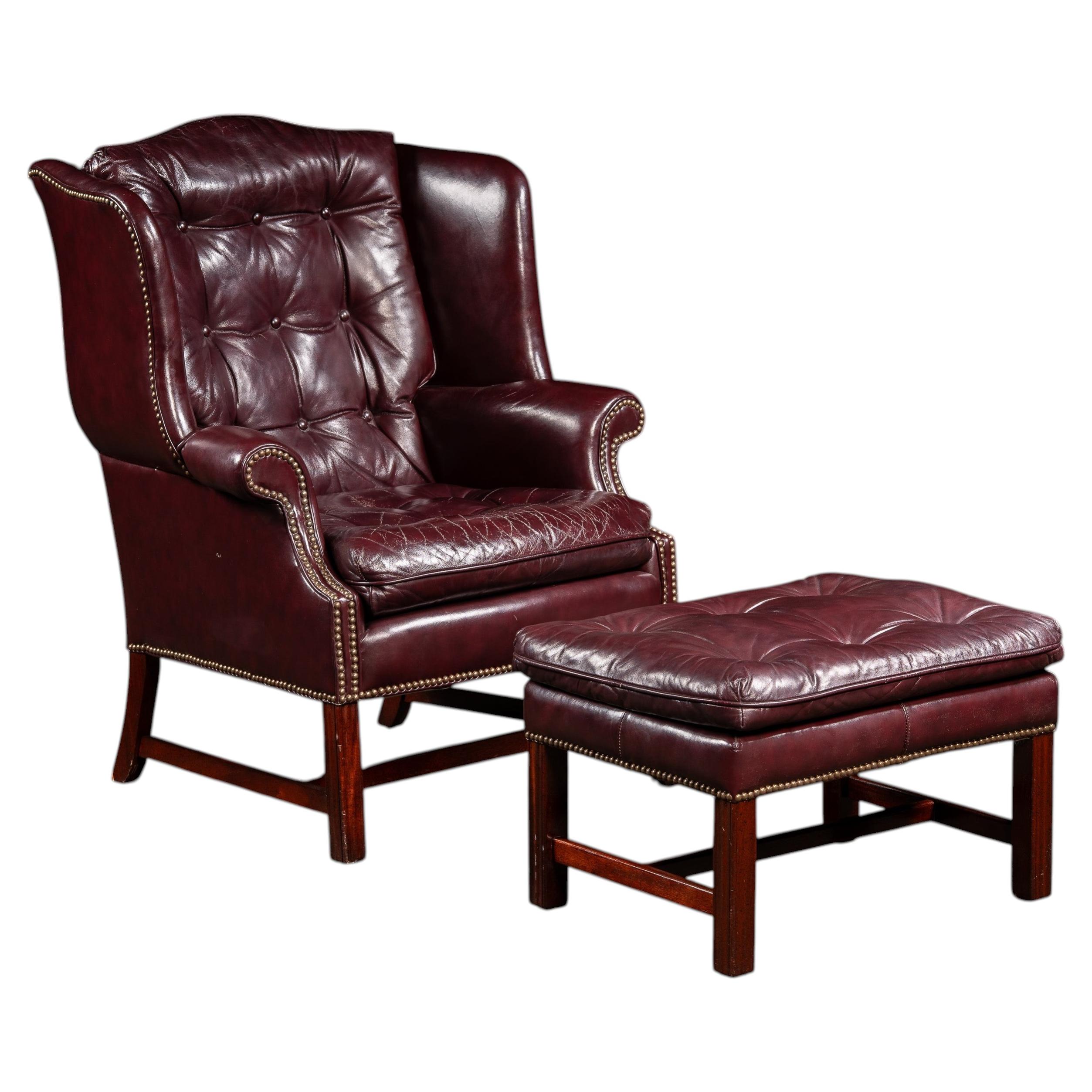 Tufted Leather Wingback Chesterfield Armchair with Ottoman in Oxblood For Sale
