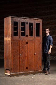 Antique Massive Oak Cabinet with Glass Doors and Interior Cubbies