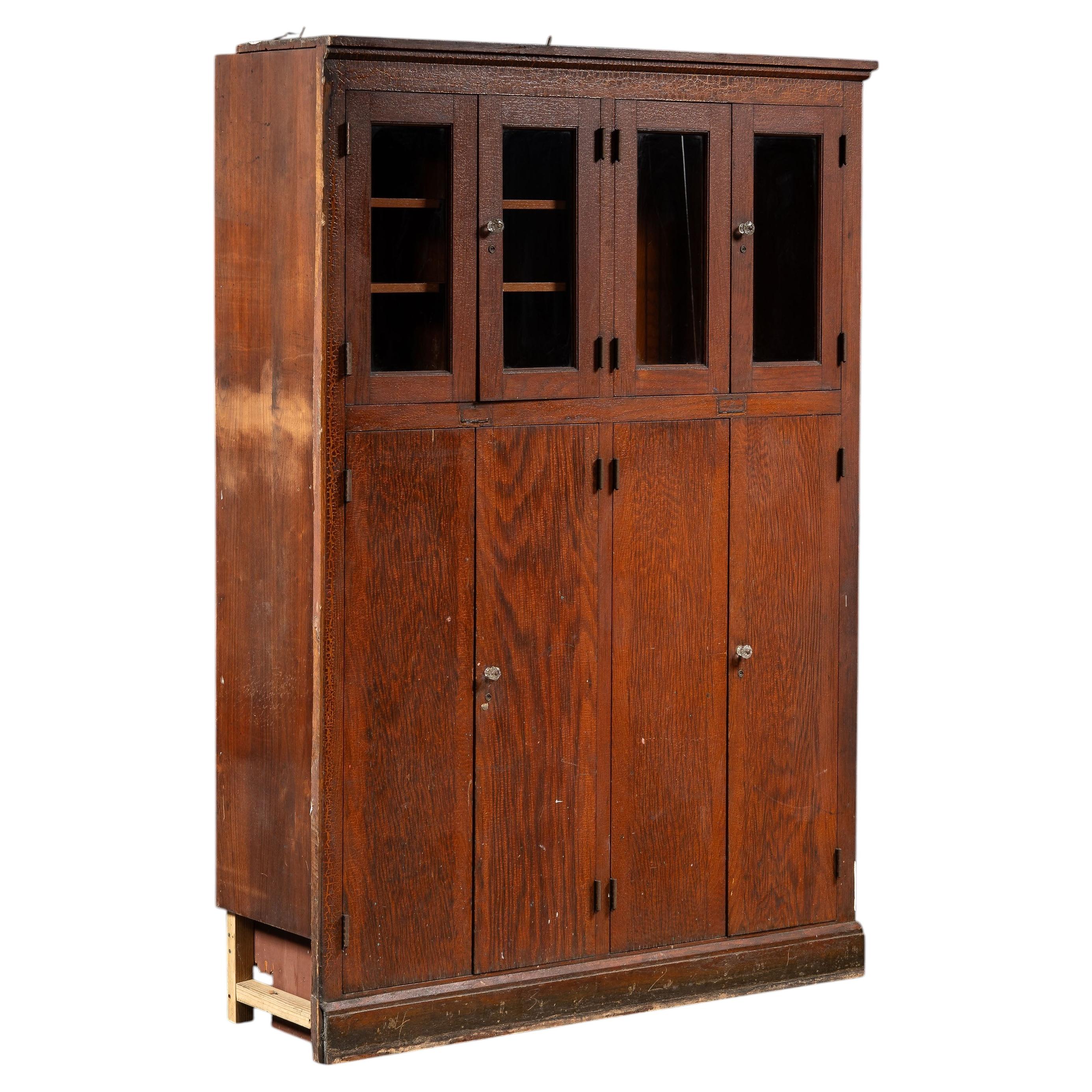 Antique Massive Oak Cabinet with Glass Doors and Interior Cubbies For Sale
